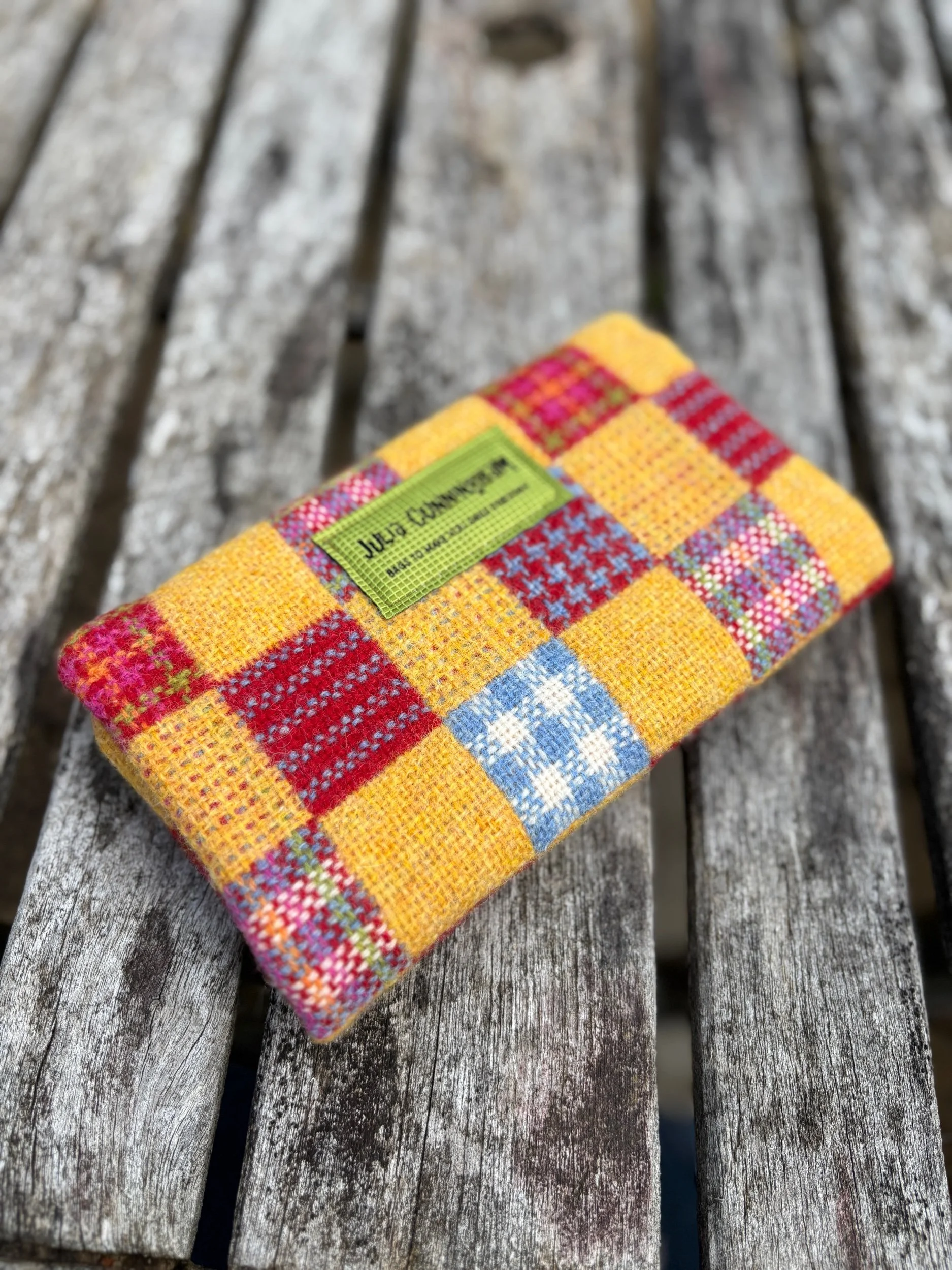 Back view of handmade Hinnigan tweed clutch bag featuring Julia Cunningham designer label