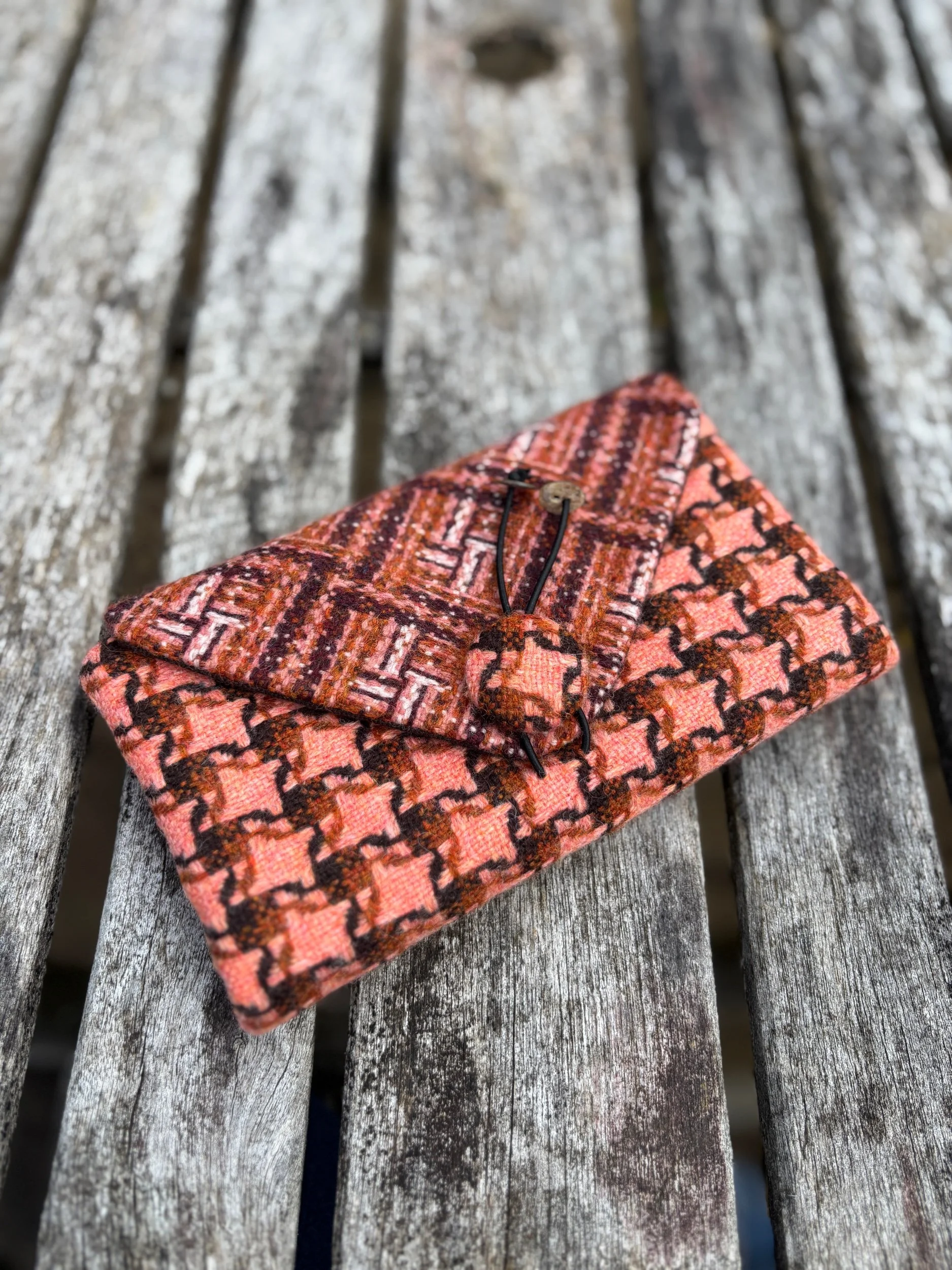 Front view of handmade Scottish clutch bag in peach contemporary tweed by Julia Cunningham