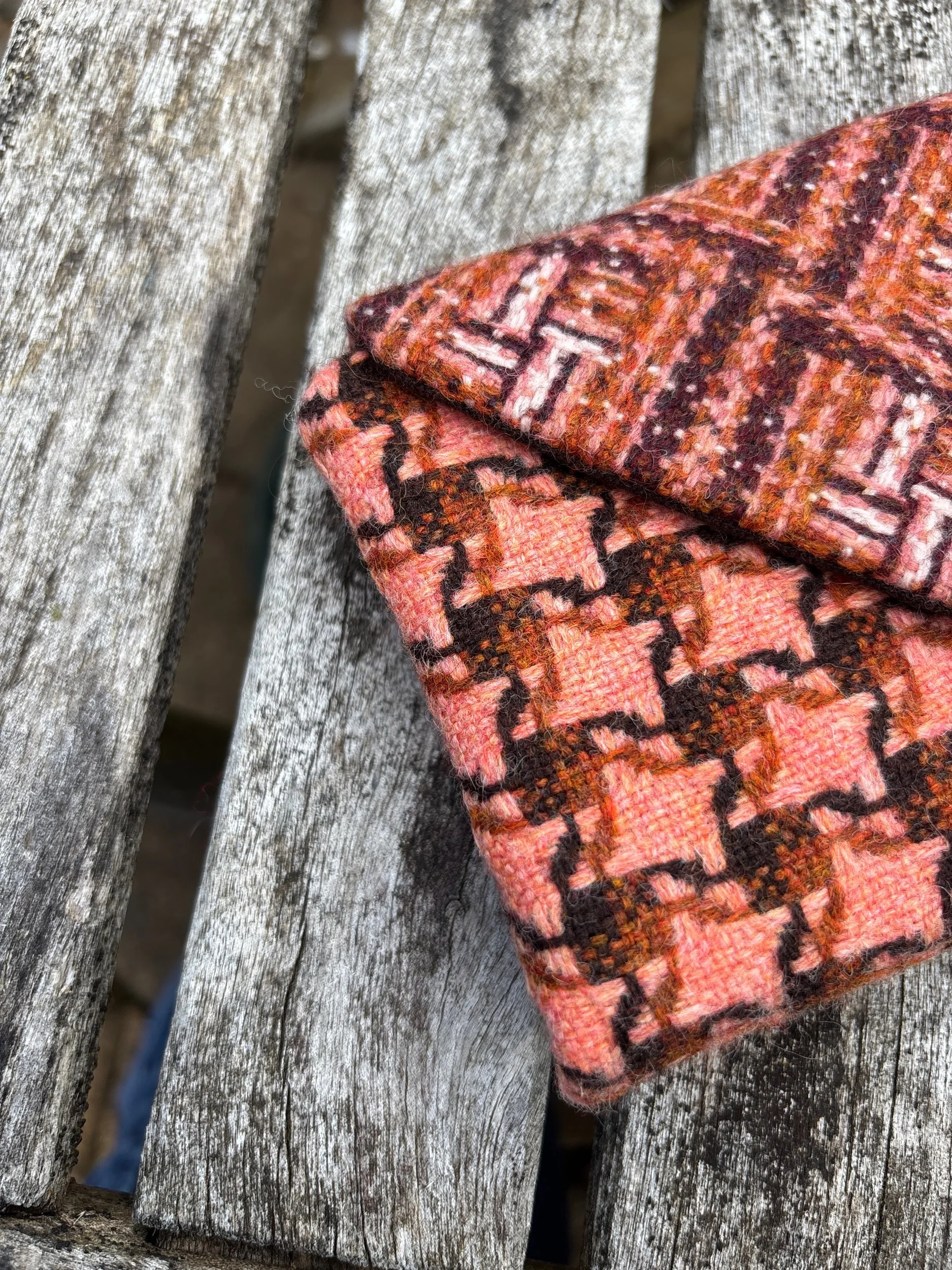 Close‑up detail of peach contemporary tweed fabric showing texture on handmade Julia Cunningham clutch bag