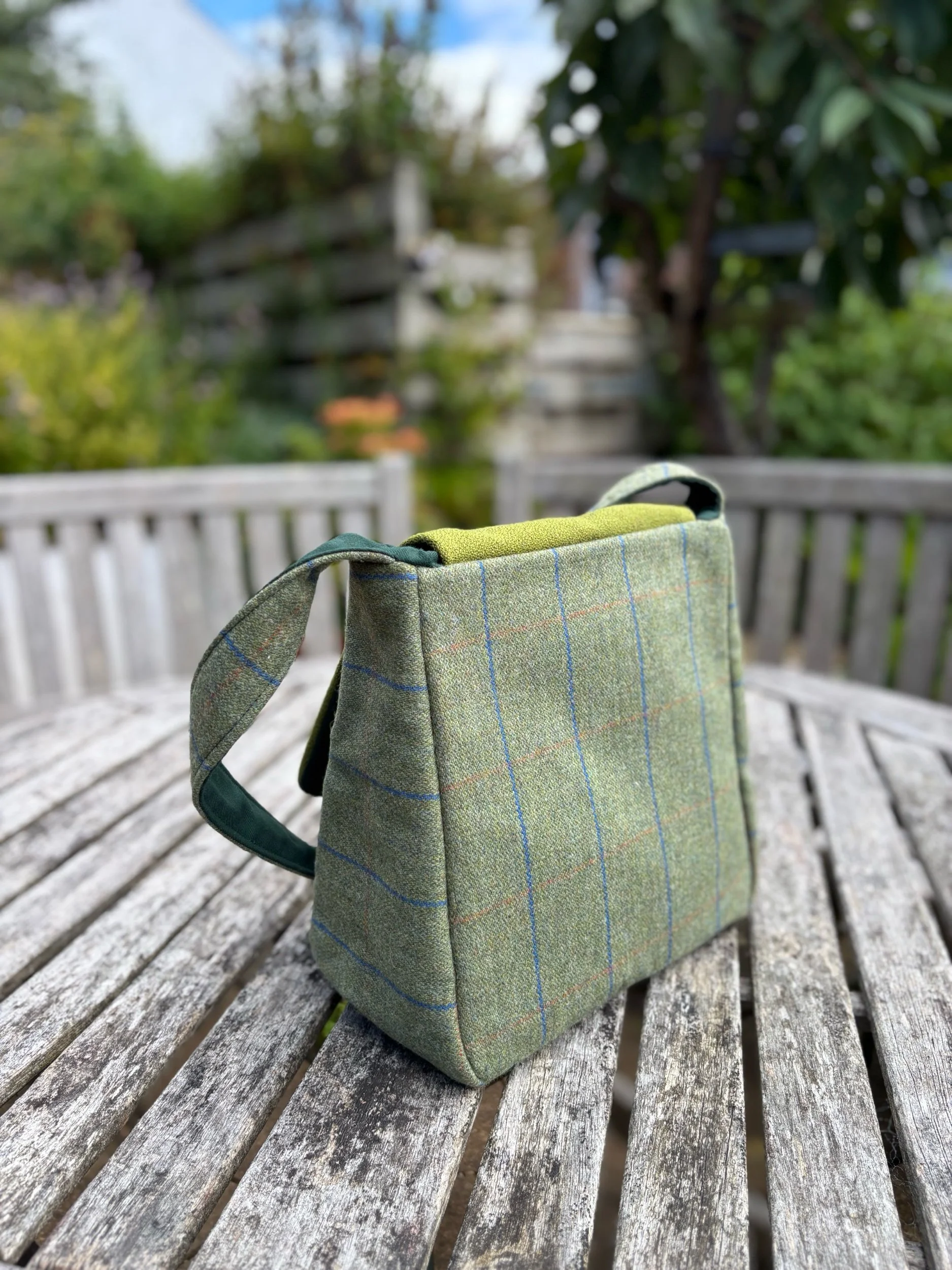 Back view of the soft‑structured green tweed bag by Julia Cunningham