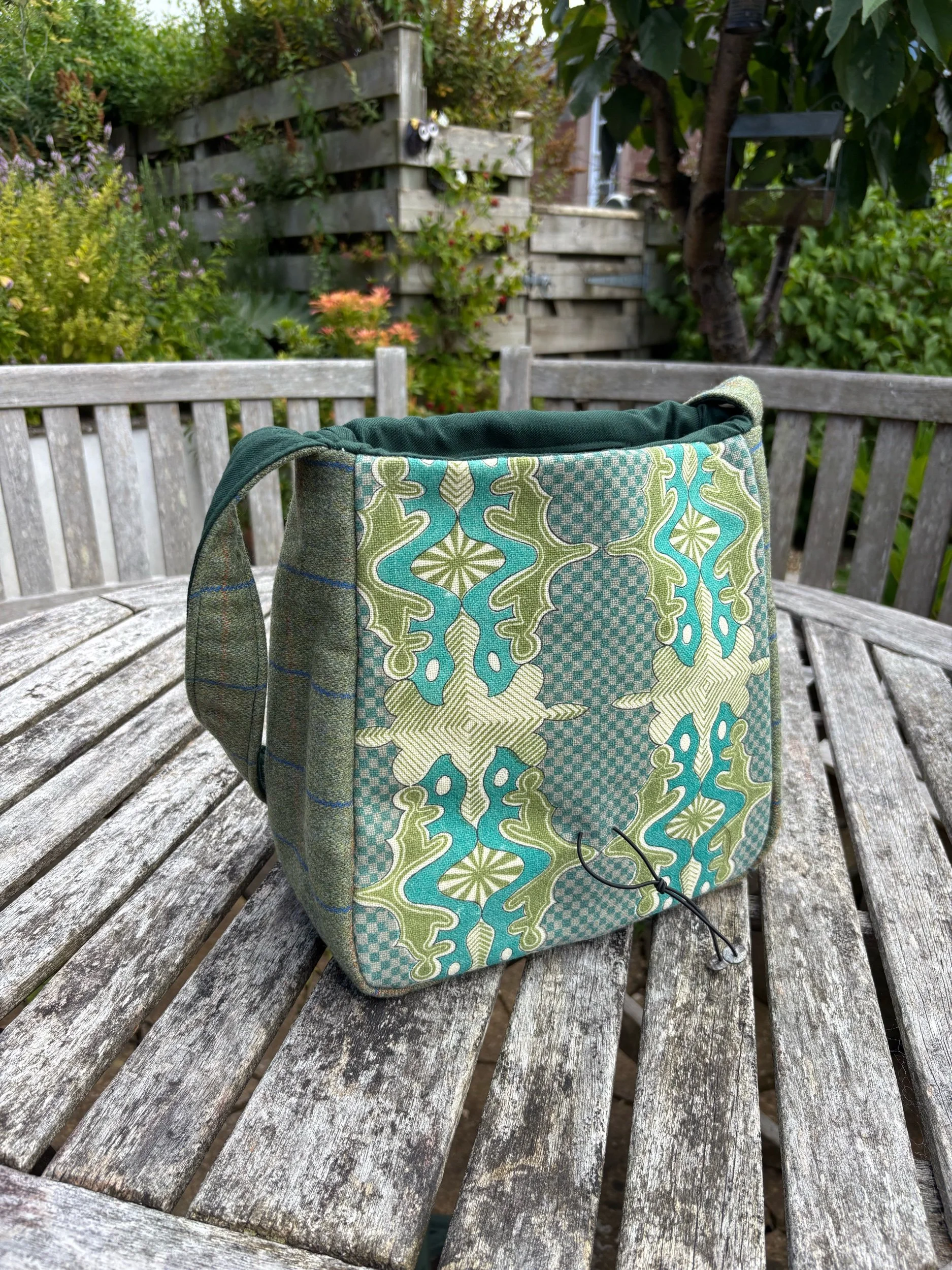 Green tweed shoulder bag detail of  vintage front panel by Julia Cunningham