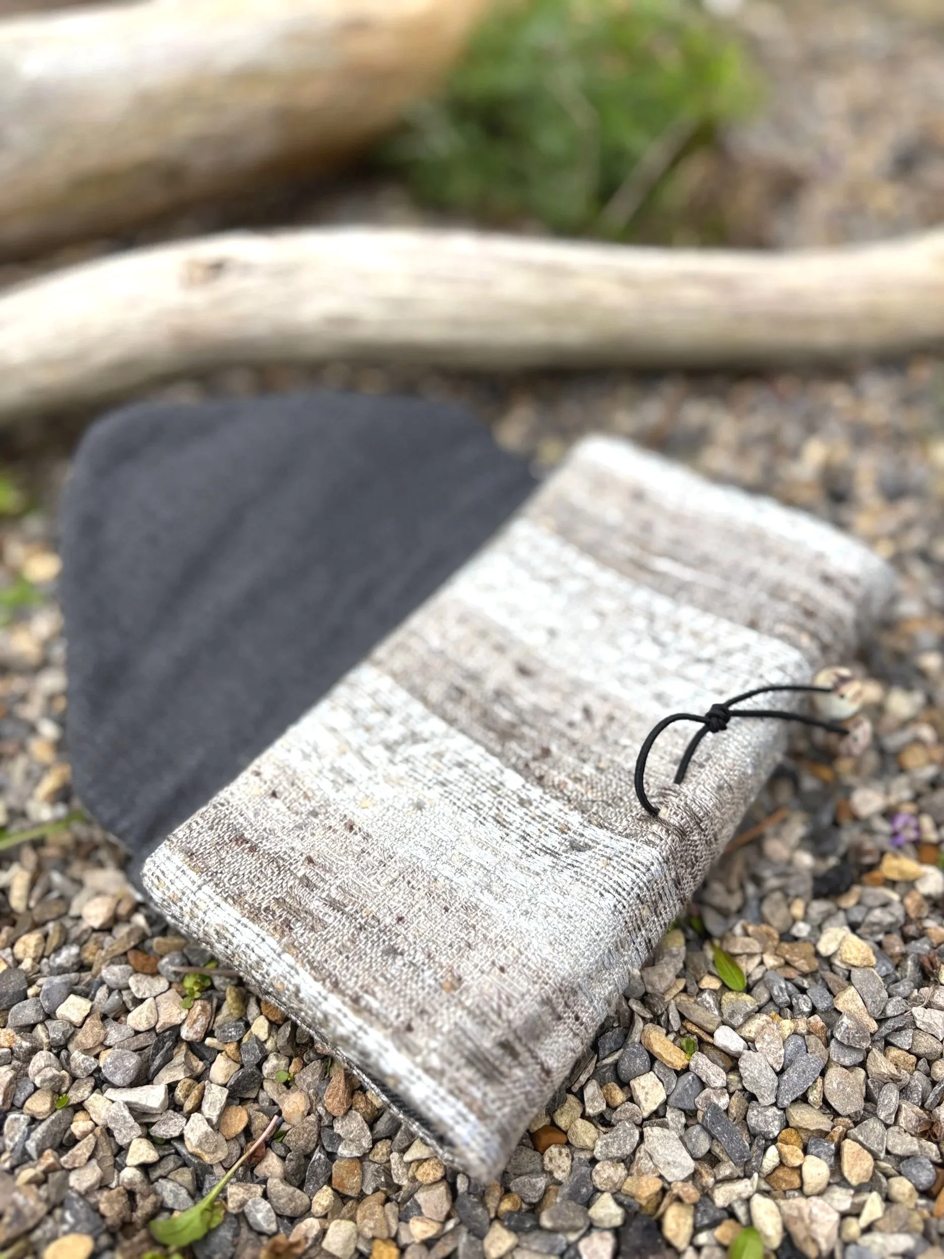 Hand-covered button and shell button detail on handmade silver and natural tweed clutch bag by Julia Cunningham