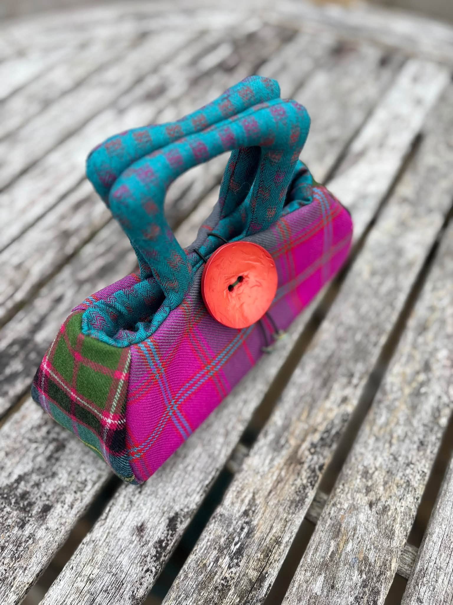 padded handles of the pink tartan handbag.jpg