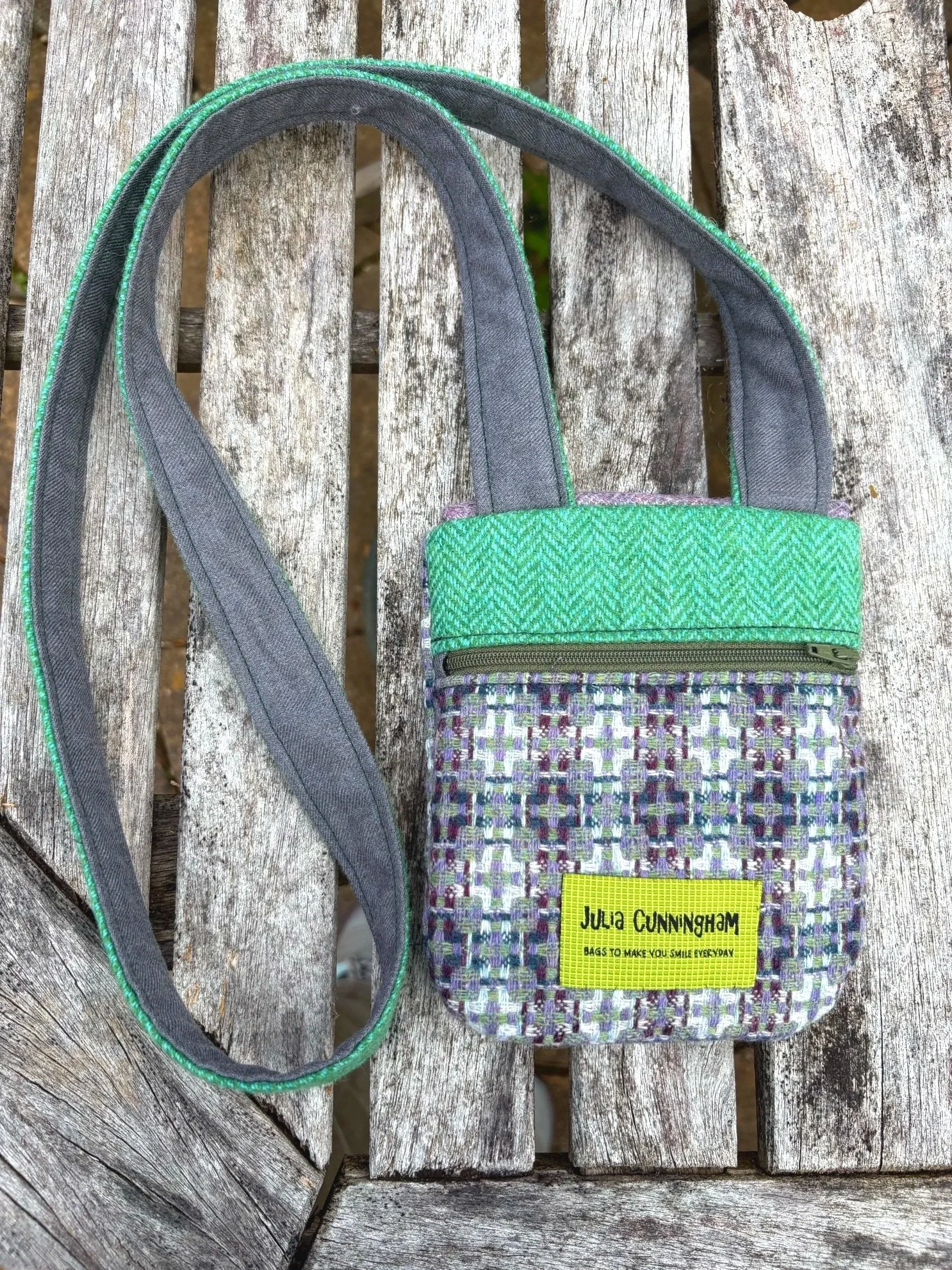 back view of crossbody phone bag showing zip
