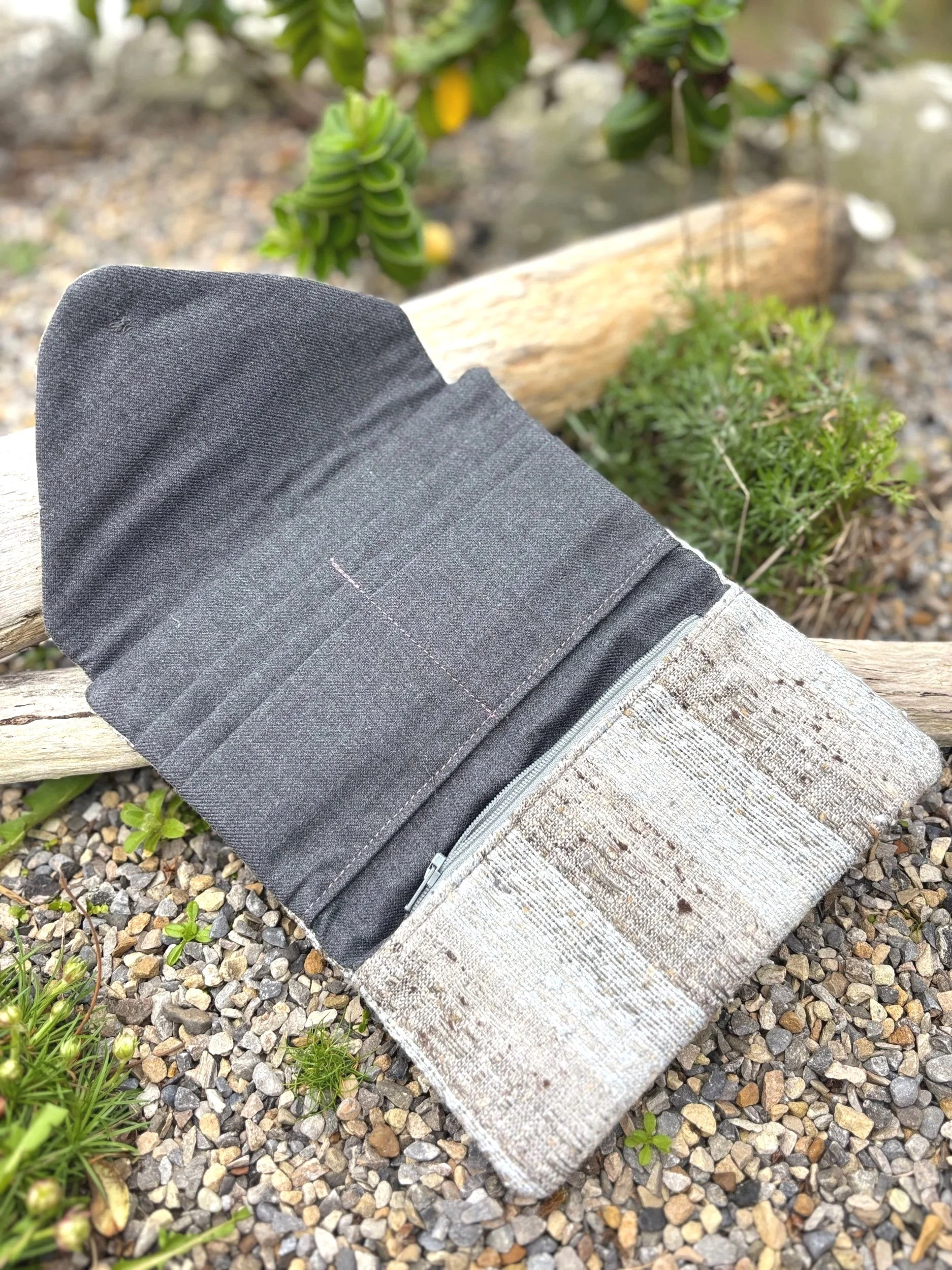 Interior of handmade Scottish clutch purse showing two large pockets, four card slots, tweed coin pocket and grey Marton Mills lining