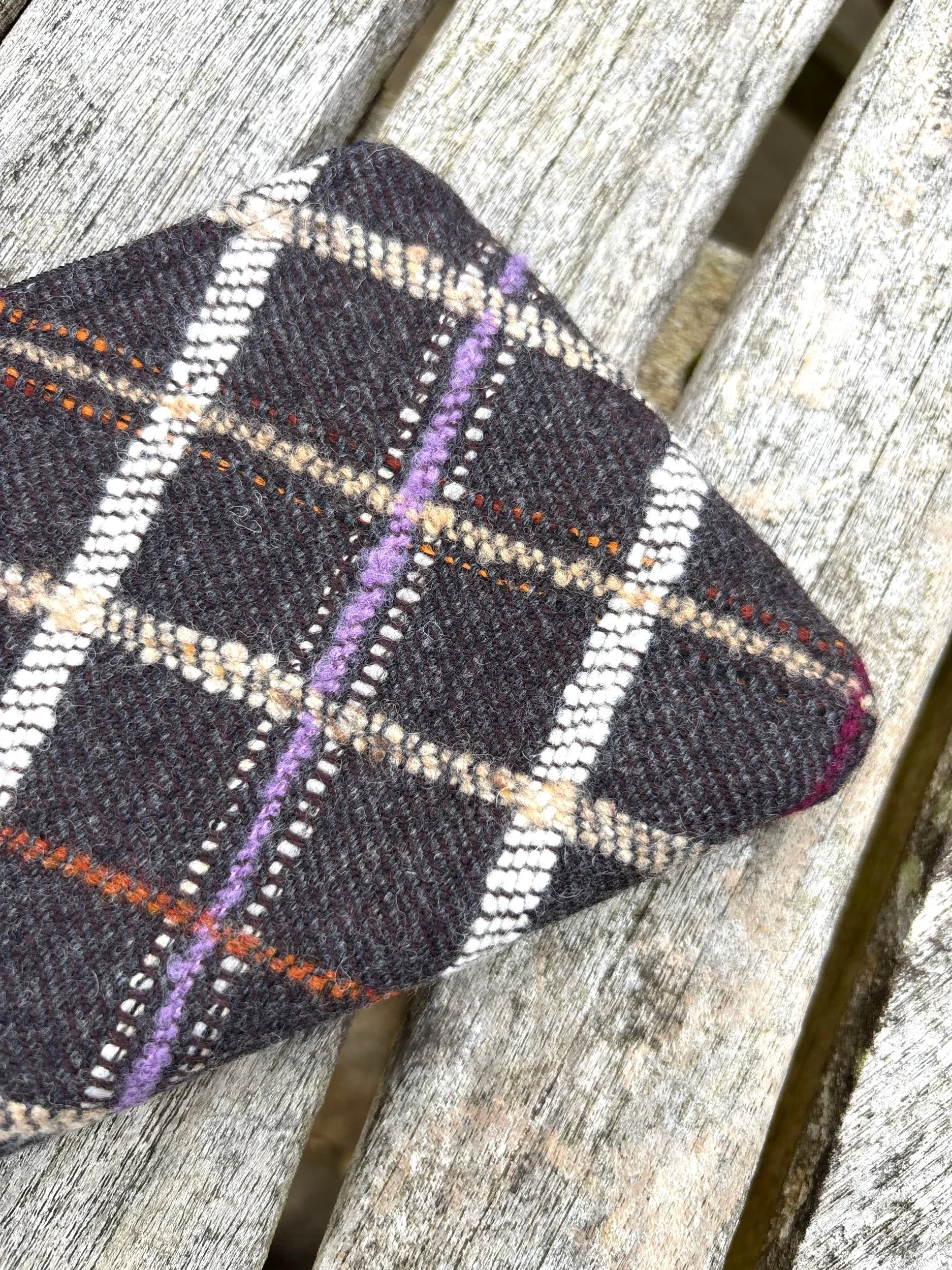Close‑up detail of the vintage Hinnigan tweed fabric used in the handmade Scottish lavender purse.