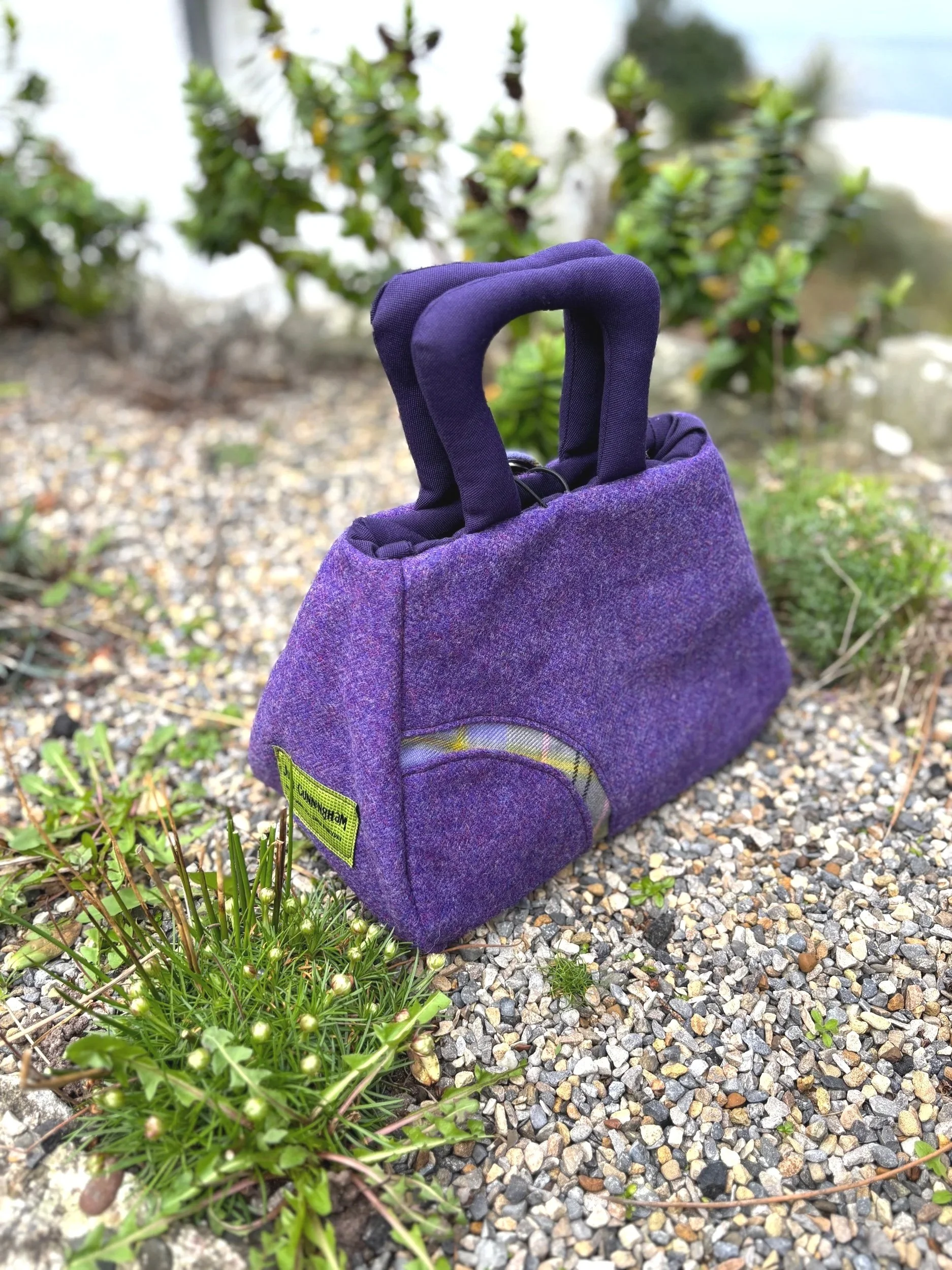 Back view of handmade Scottish Muckle Fantoosh handbag showing Taylor Ancient tartan panel on purple Marton Mills twee