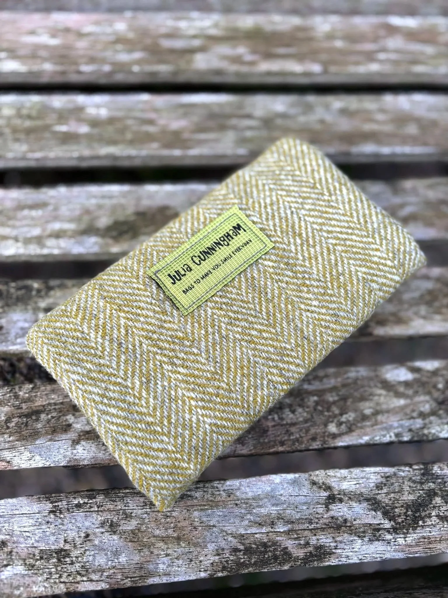 Back and brand label detail on handmade Harris Tweed clutch bag made in Scotland