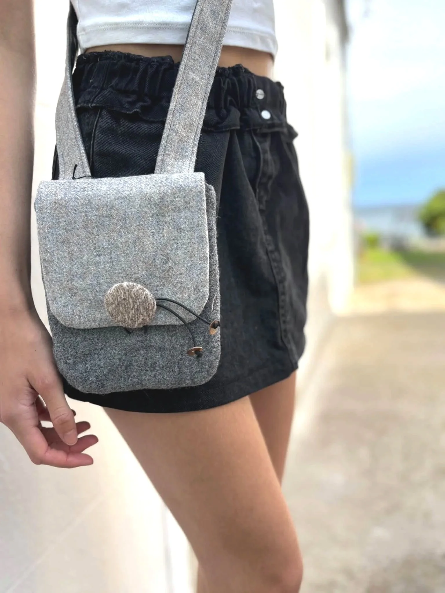 lifestyle image of a model wearing a crossbody phone bag by julia cunningham