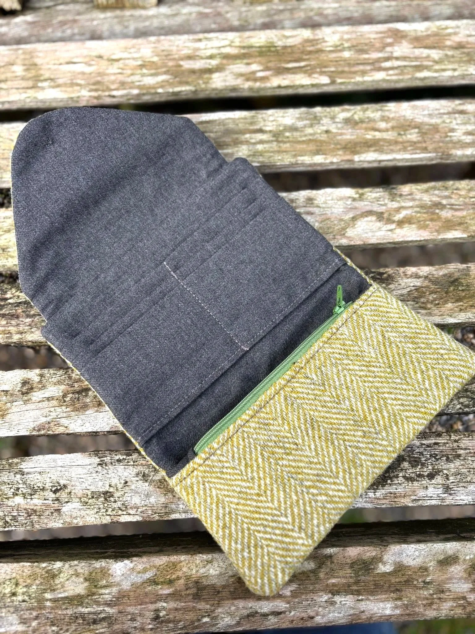 Interior of handmade Harris Tweed clutch purse showing card slots, zip pocket and lining details by Julia Cunningham