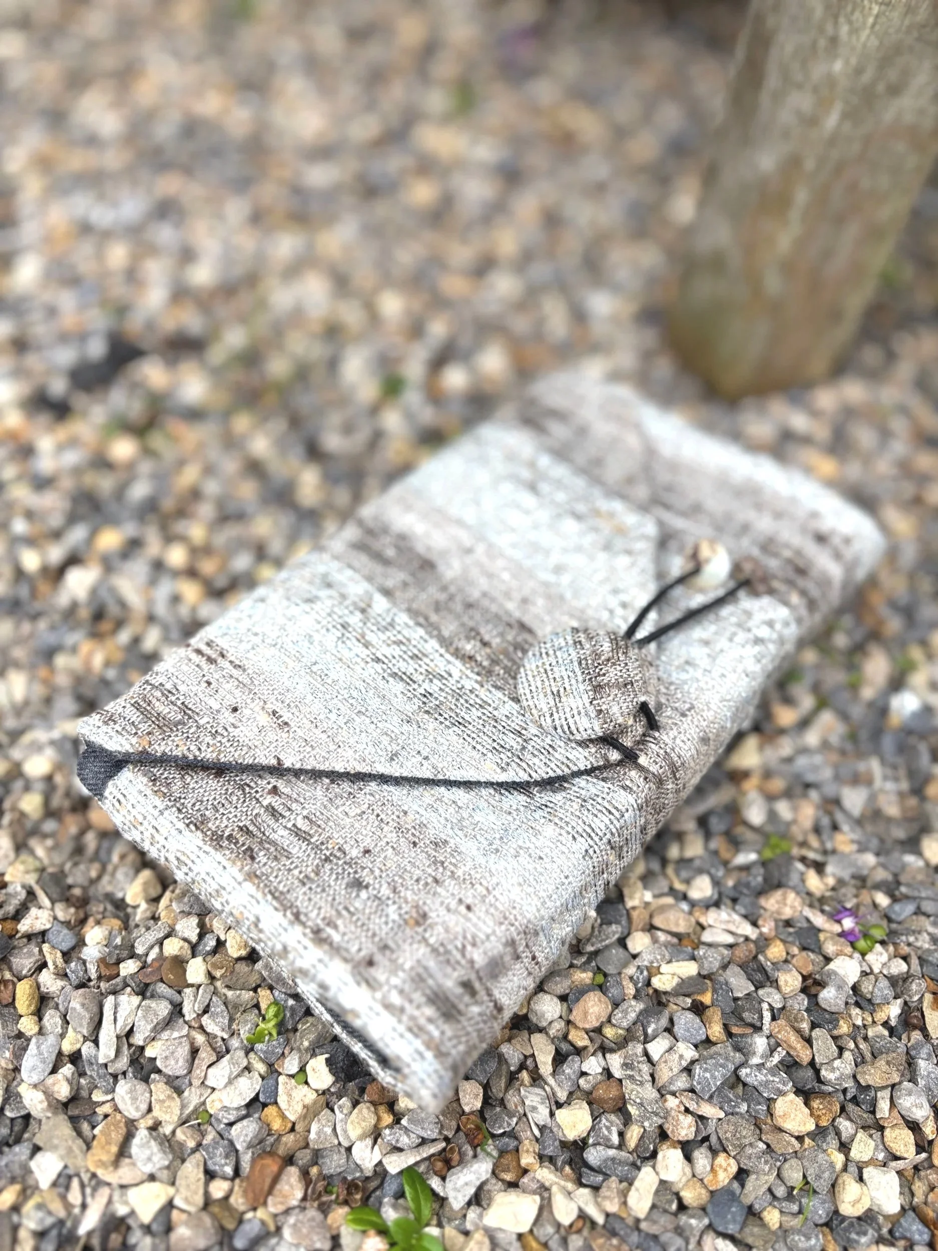 Handmade silver and natural vintage tweed clutch bag and purse, crafted in Scotland by Julia Cunningham