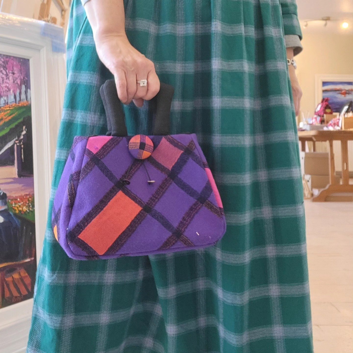 lifestyle image of a purple and orange Julia Cunningham handbag