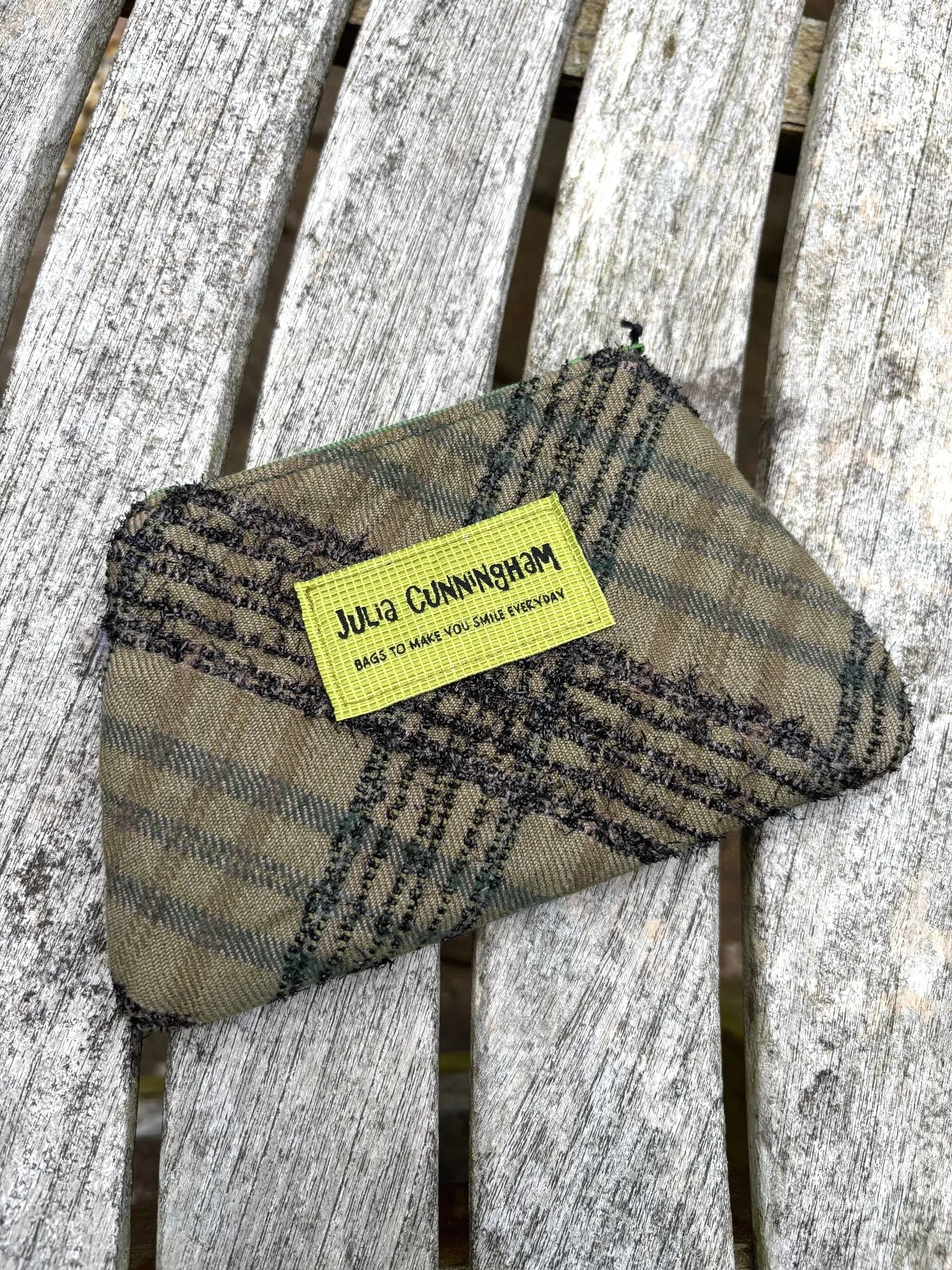 Front view of the handmade green Lochcarron tweed lavender purse crafted in Scotland by Julia Cunningham.