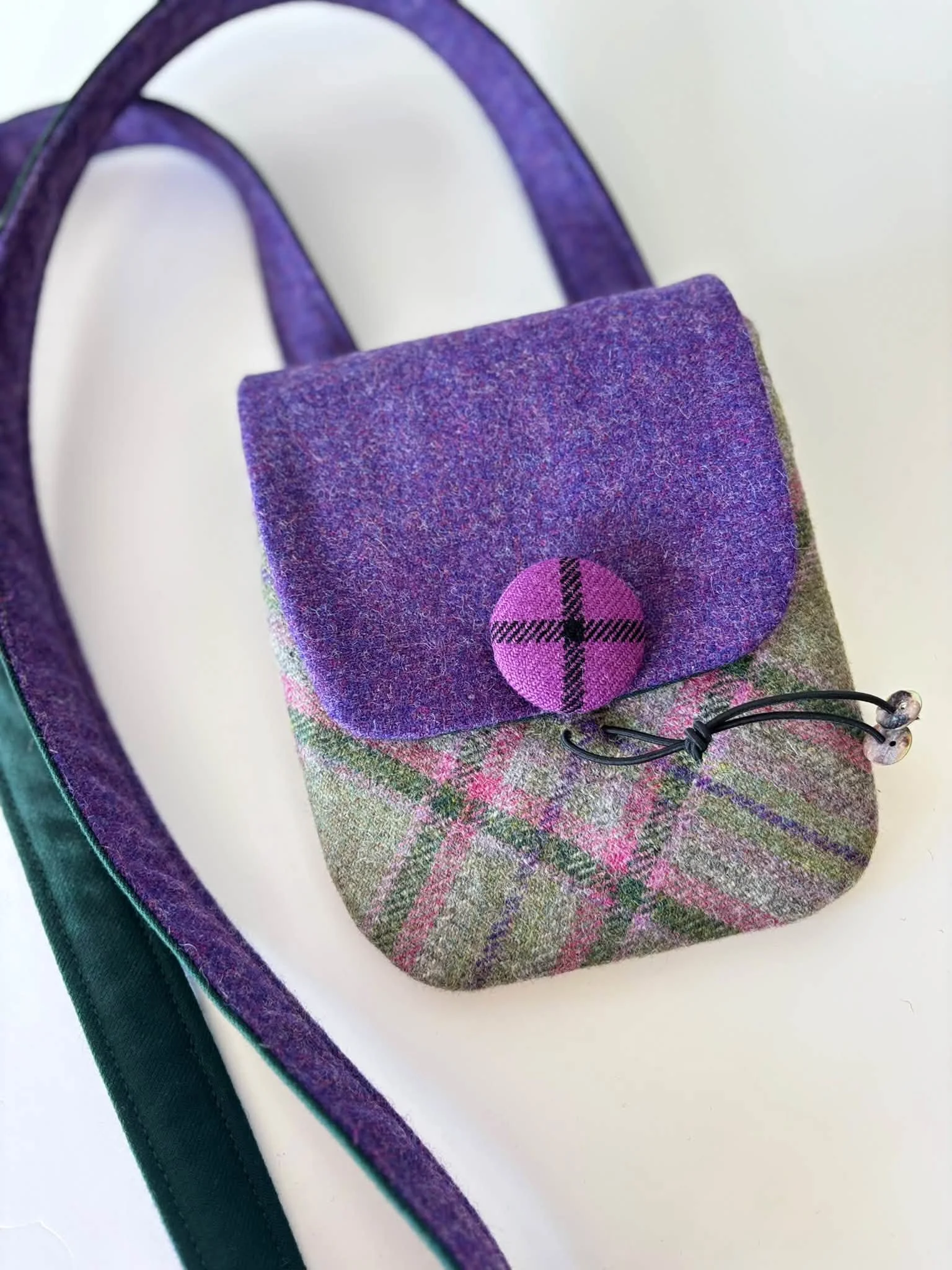 Handmade Tweedling cross body phone bag in green and purple tweed and tartan