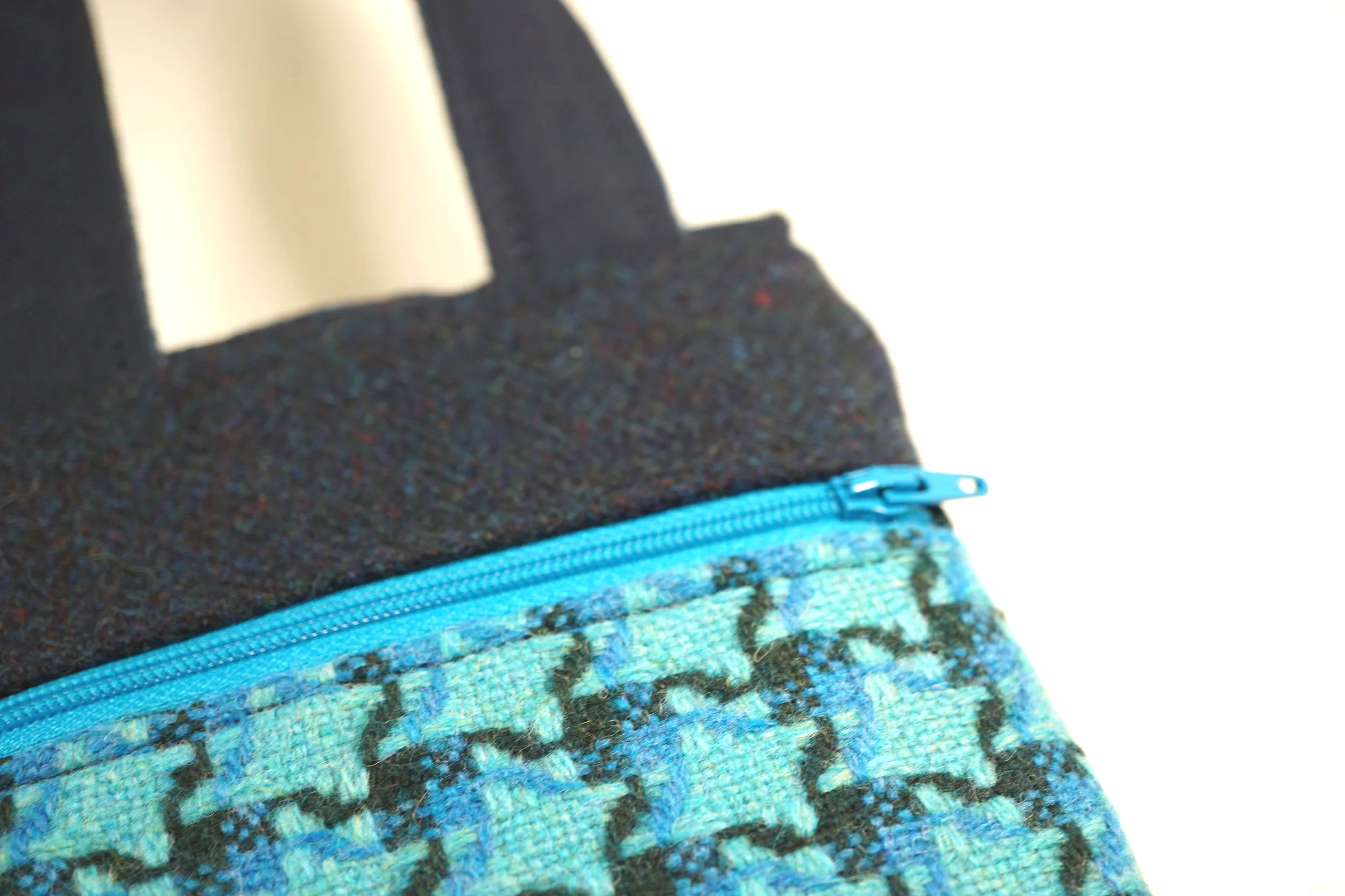 bright blue zip detail on a cross body phone bag in blue