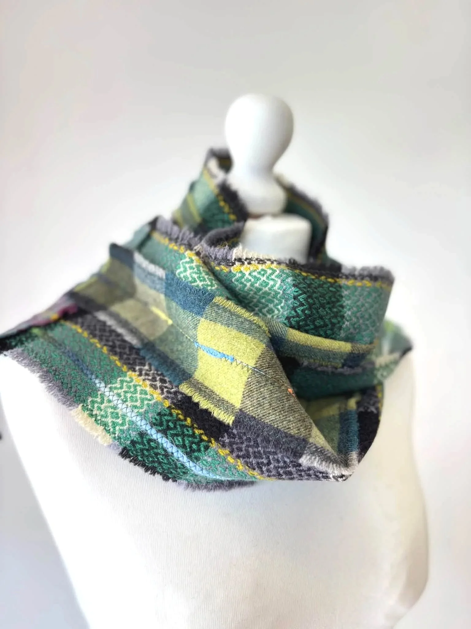 mannequin wearing a handmade green wool scarf