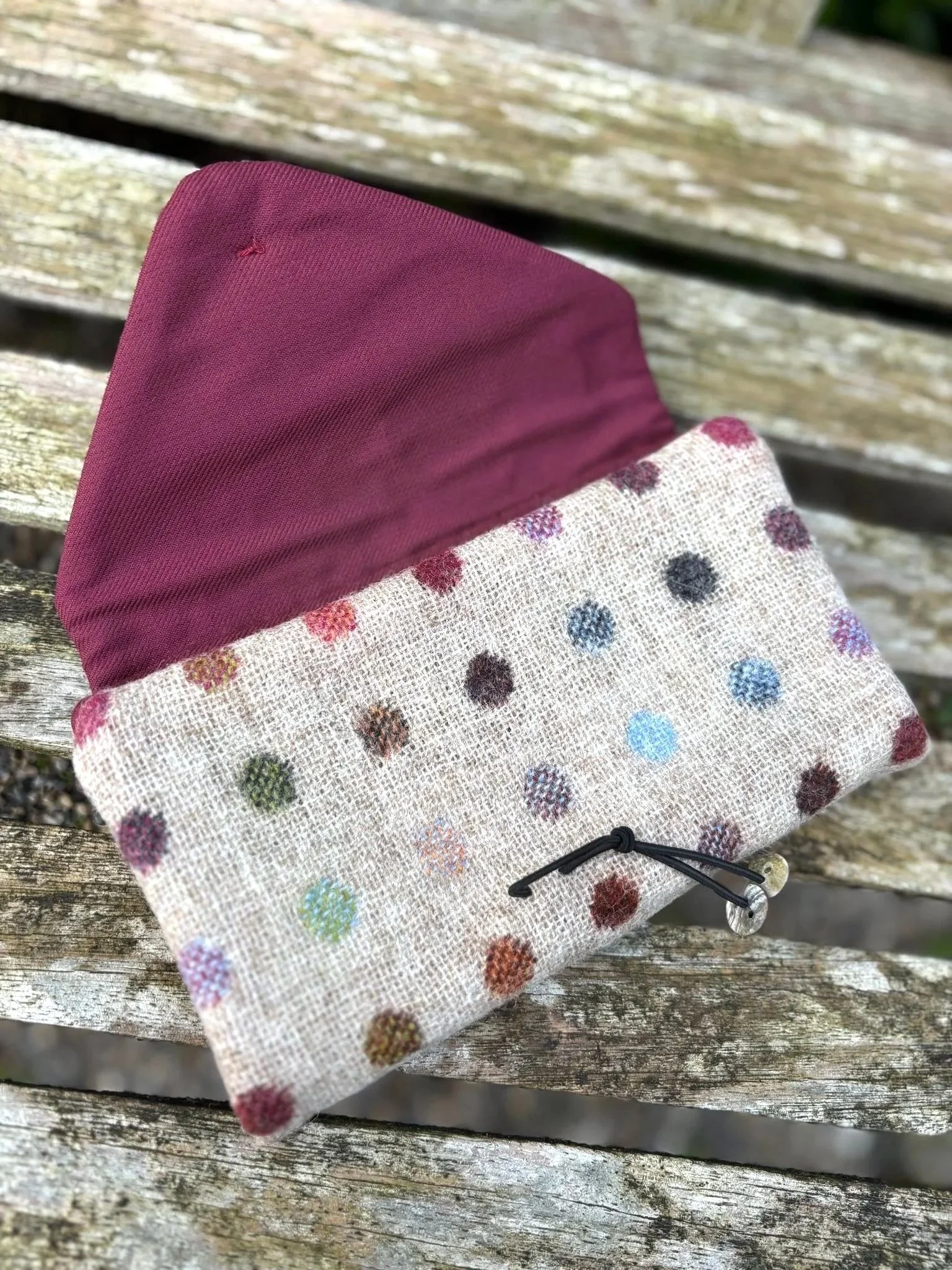 Hand-covered button and shell button detail on handmade Spotty Hinnigan tweed clutch bag made in Scotland