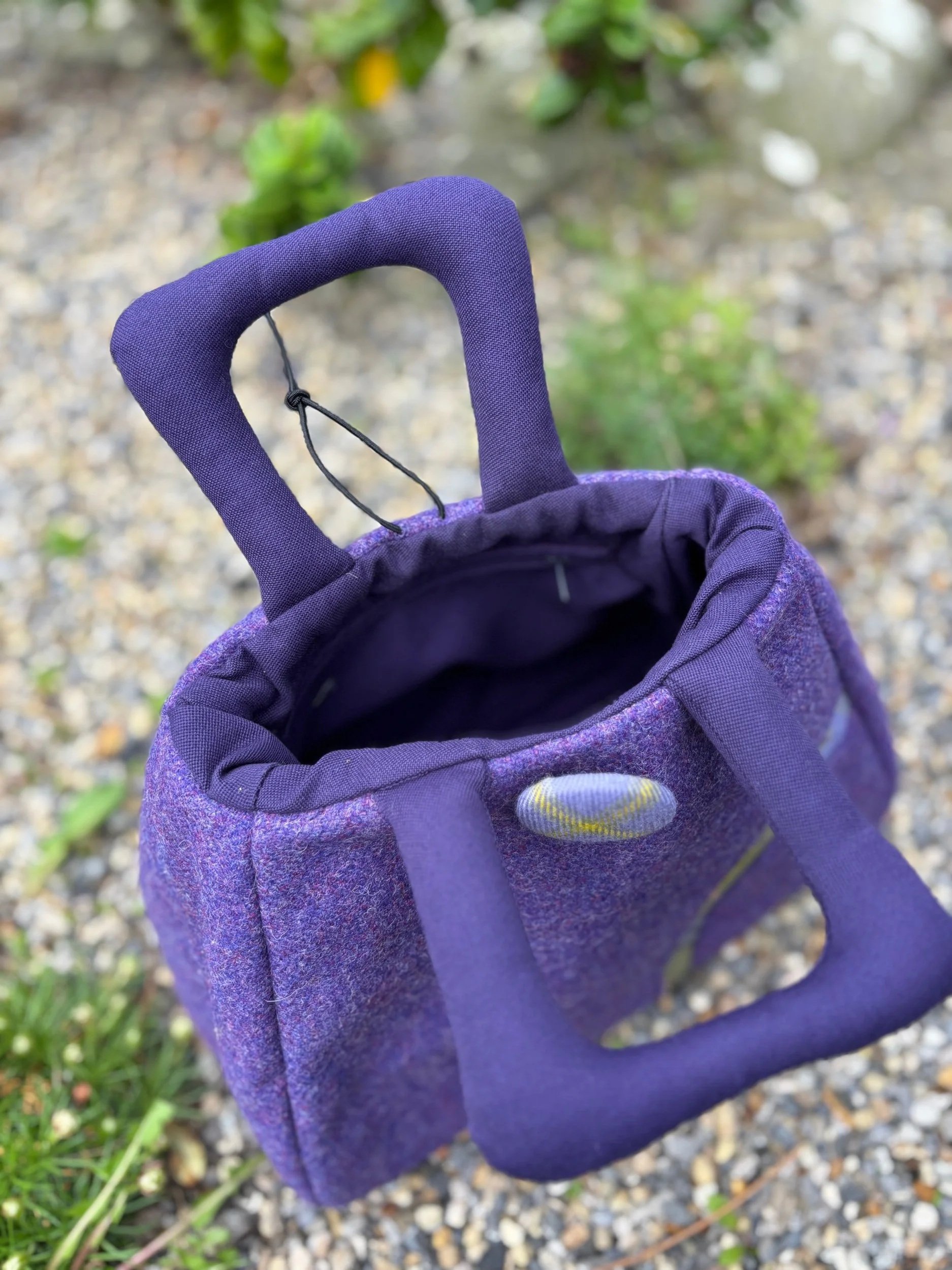 Padded handles and hand-covered tartan button detail on handmade Scottish Muckle Fantoosh handbag by Julia Cunningham