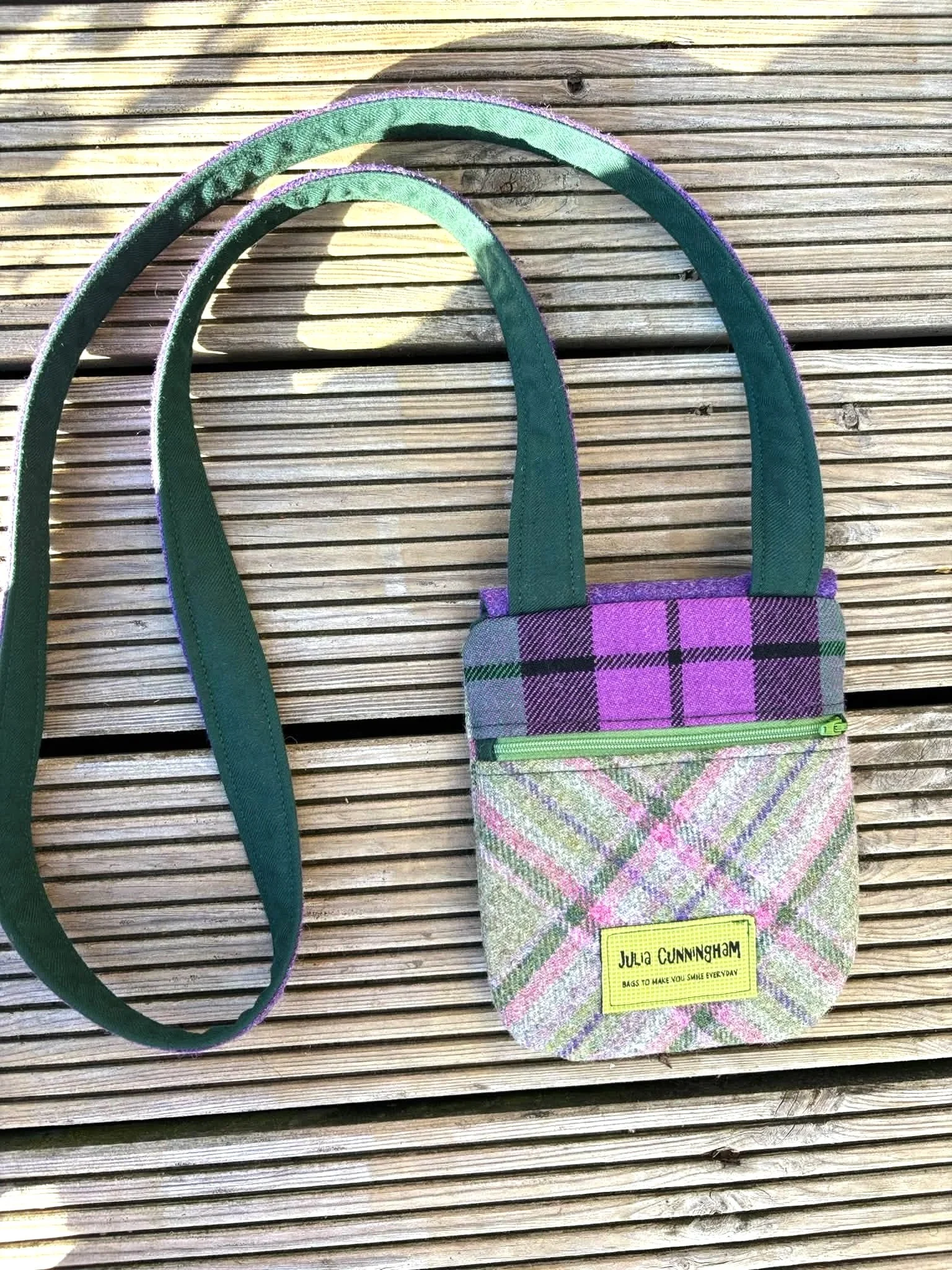 back image of handmade crossbody phone bag in purple and green tweed and tartan outside