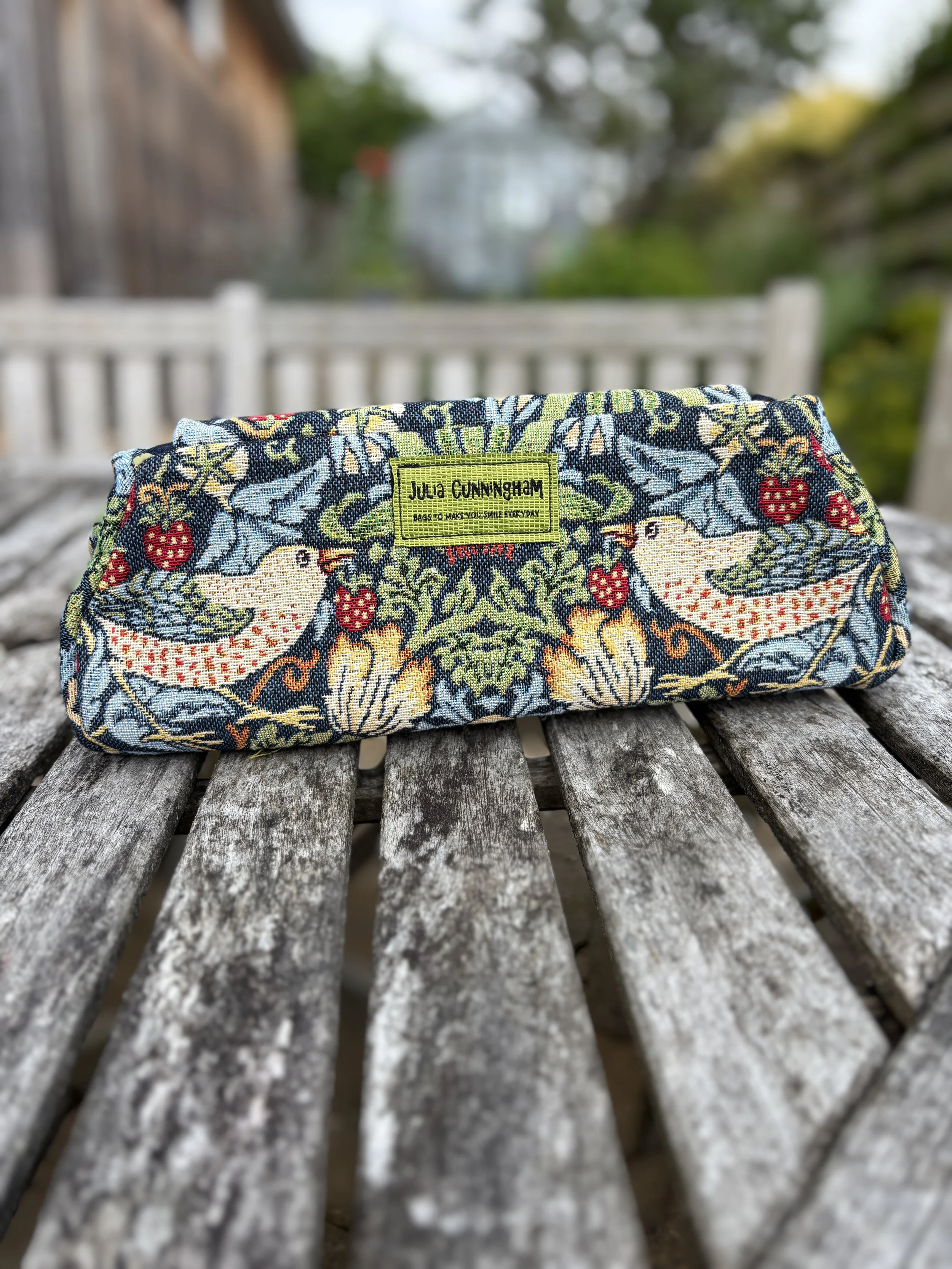 back view with Julia Cunningham label of brocade clutch bag