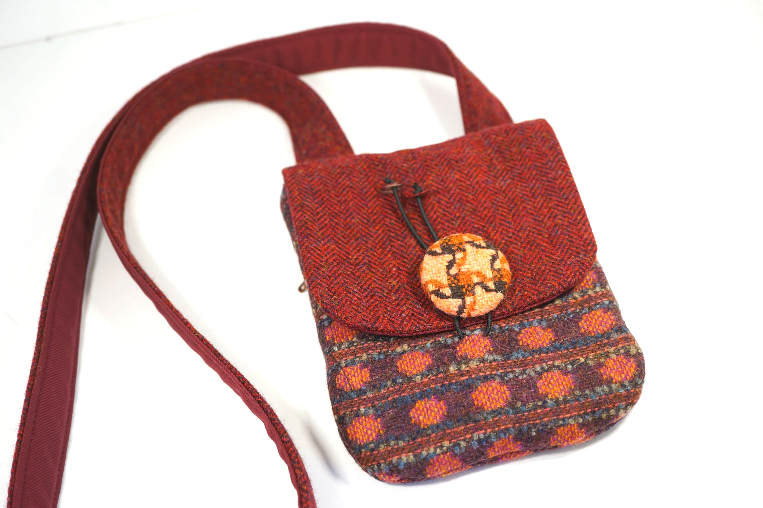 Handmade Tweedling cross body phone bag in mixed tweeds in red and brown