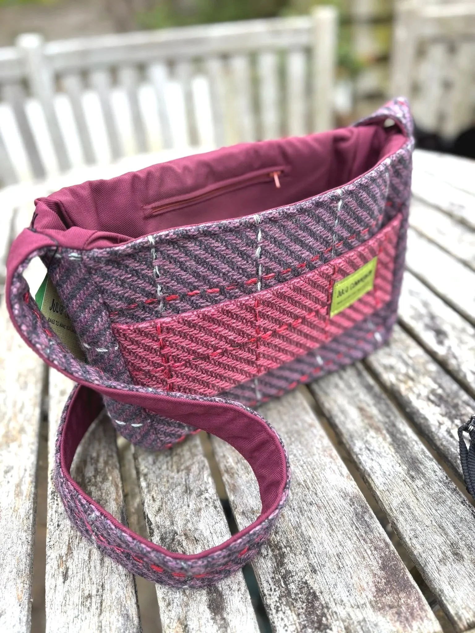 Red Marton Mills lined interior with zipped pocket inside handmade pink tweed crossbody bag by Julia Cunningham