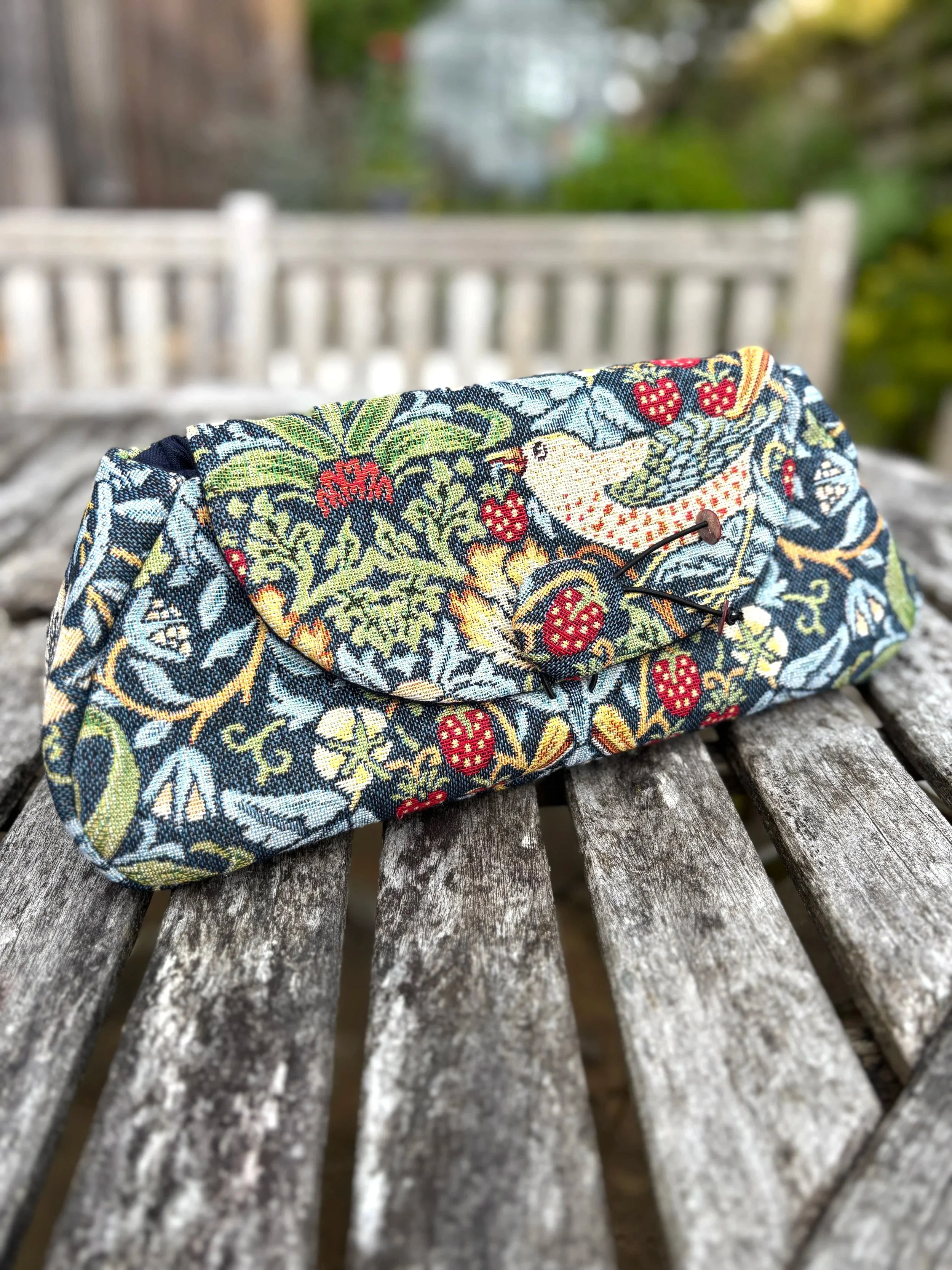 handmade floral brocade clutch bag side view