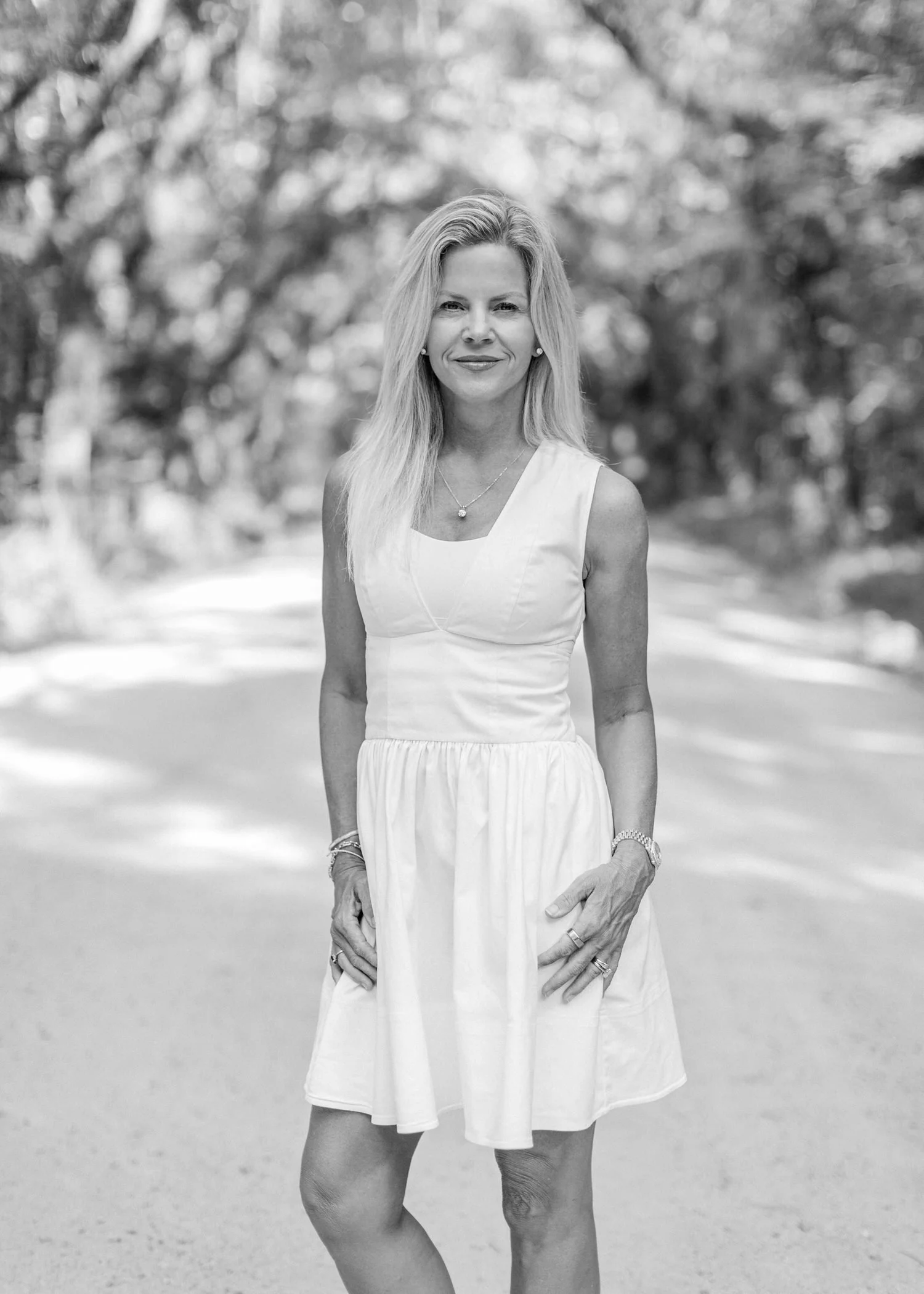 Venus Morris Griffin portrait black and white in wooded area sunlit