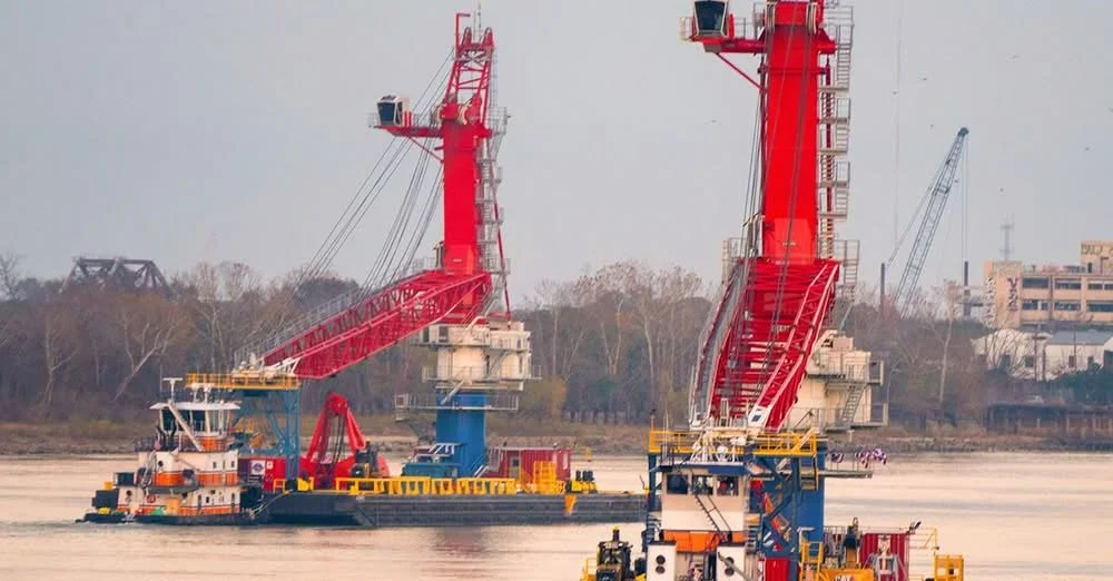 Two All‑Electric Liebherr CBG 500 E Cranes Working on the Mississippi