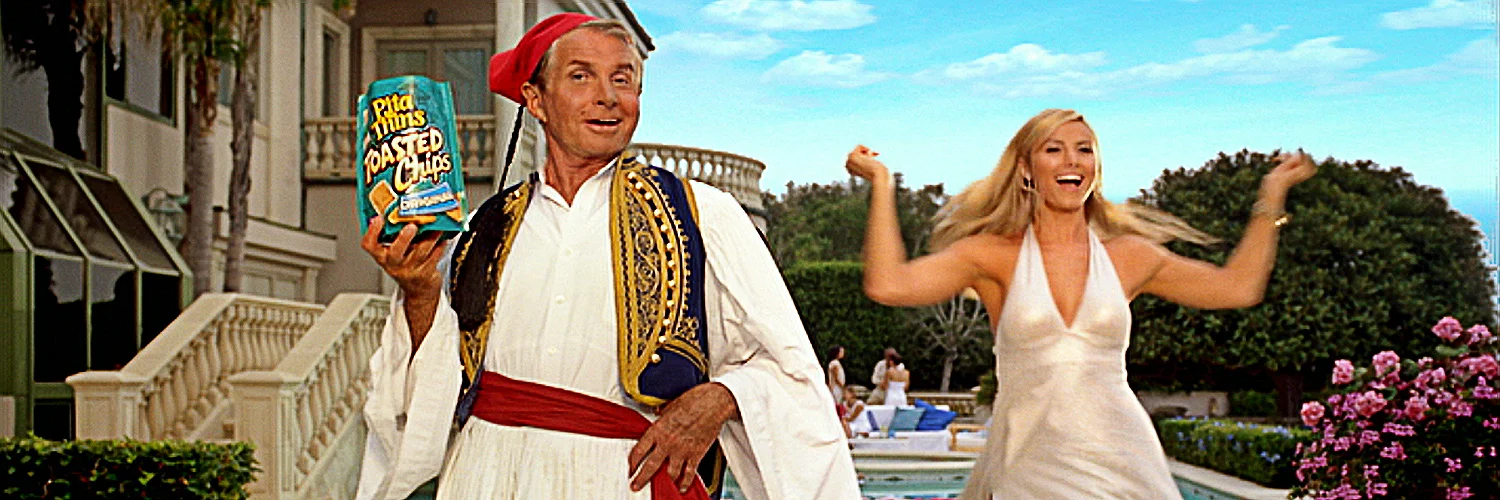   Client:  Nabisco, Pita Thins  Agency:  JWT  Debuting during the 2006 Emmys telecast, this comedic spot features Toasted Chips spokesman George Hamilton dancing in a Greek fustanella with his Dancing with the Stars co-contestant and former WWE Diva 