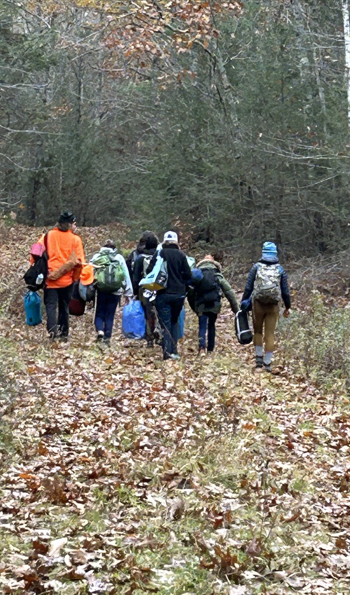 Teens hike toward their weekend campsite for a Hearty Roots expedition.jpg