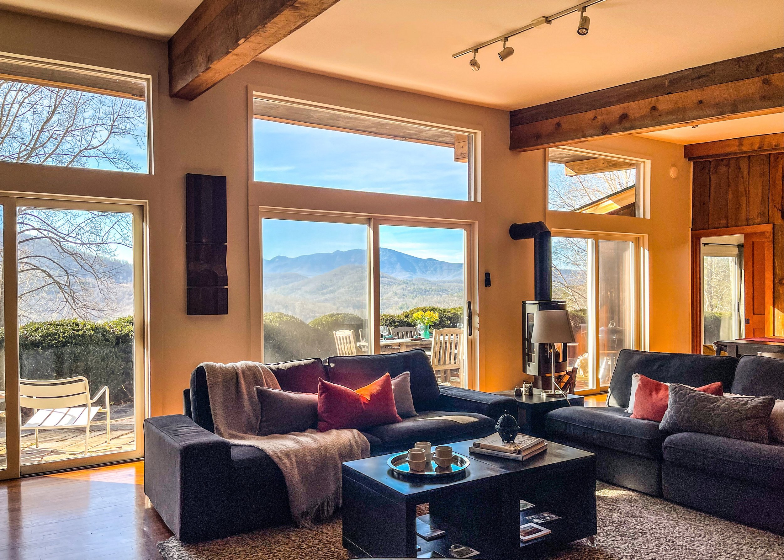  The living room offers plenty of seating and the open floor plan means you are always a part of the fun. Big views of the Black Mountains and Mount Mitchell are the hallmark of this room. the gas log stove makes it extra cozy! 