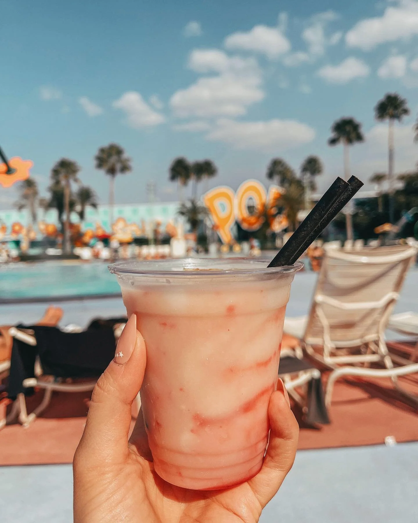 ♡ manifesting more days like this ♡
&bull;
&bull;
I honestly don&rsquo;t think anywhere on Disney property gives me as much serotonin as being at Pop Century does 🥹💕 my favorite pool drink from Petals is a pi&ntilde;a colava with a banana rum float