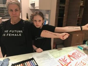 The author and her daughter preparing for the Women's March in part to honor her grandmother's legacy of leadership.