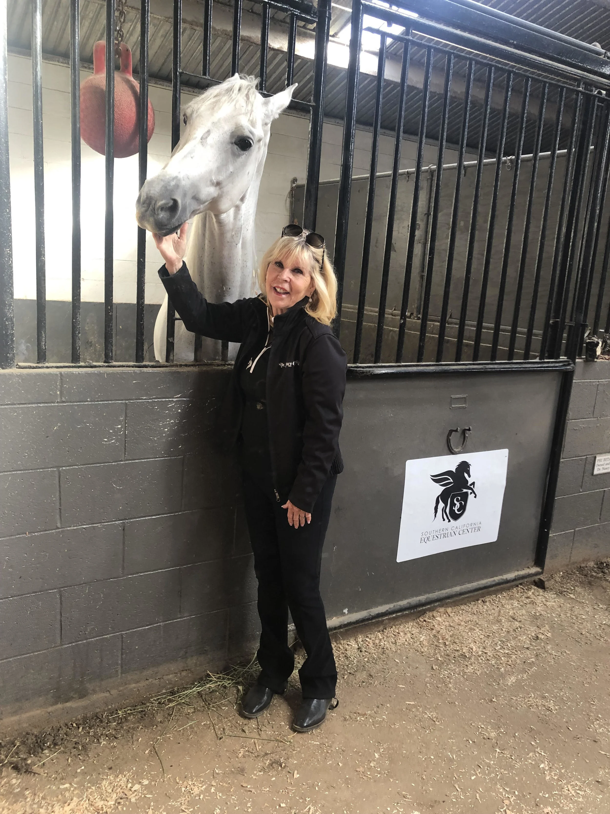 Dr. Nancy O’Reilly loving on one of her beautiful horses at her Southern California Equestrian Center. She’s also Take The Lead’s board chair.