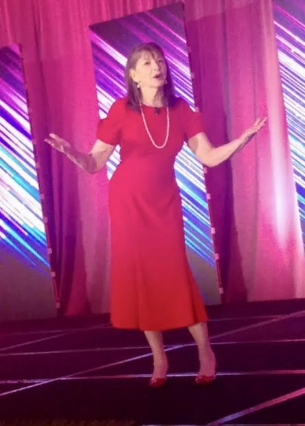 Yes, I was the speaker in the red dress who walked around on the stage.
