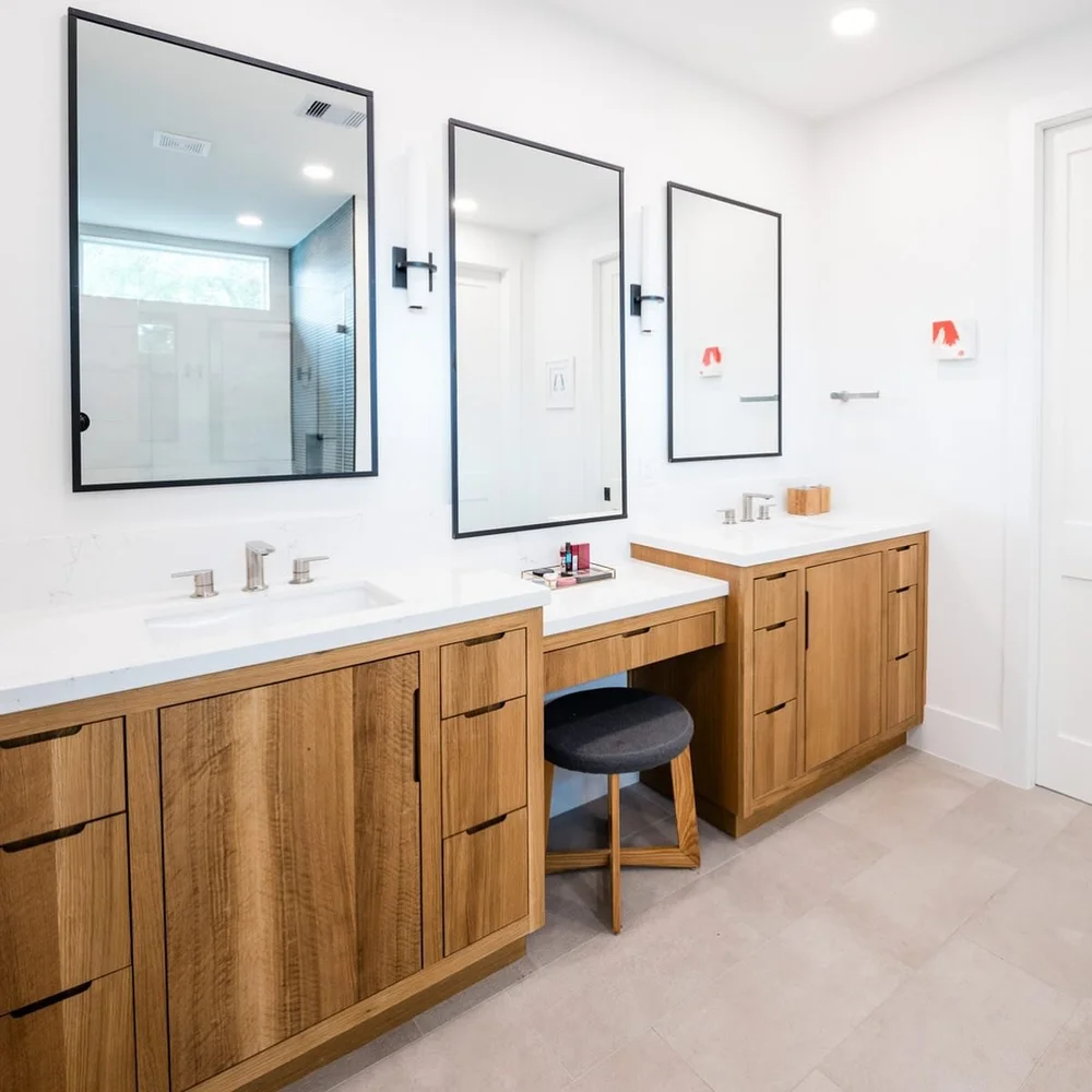 Every corner of this bathroom has a story to tell.

We wanted the vanity to feel warm and welcoming, so we chose a rich wood tone with clean, hardware-free drawers&mdash;letting the natural grain take center stage.

The tub-shower combo strikes the p