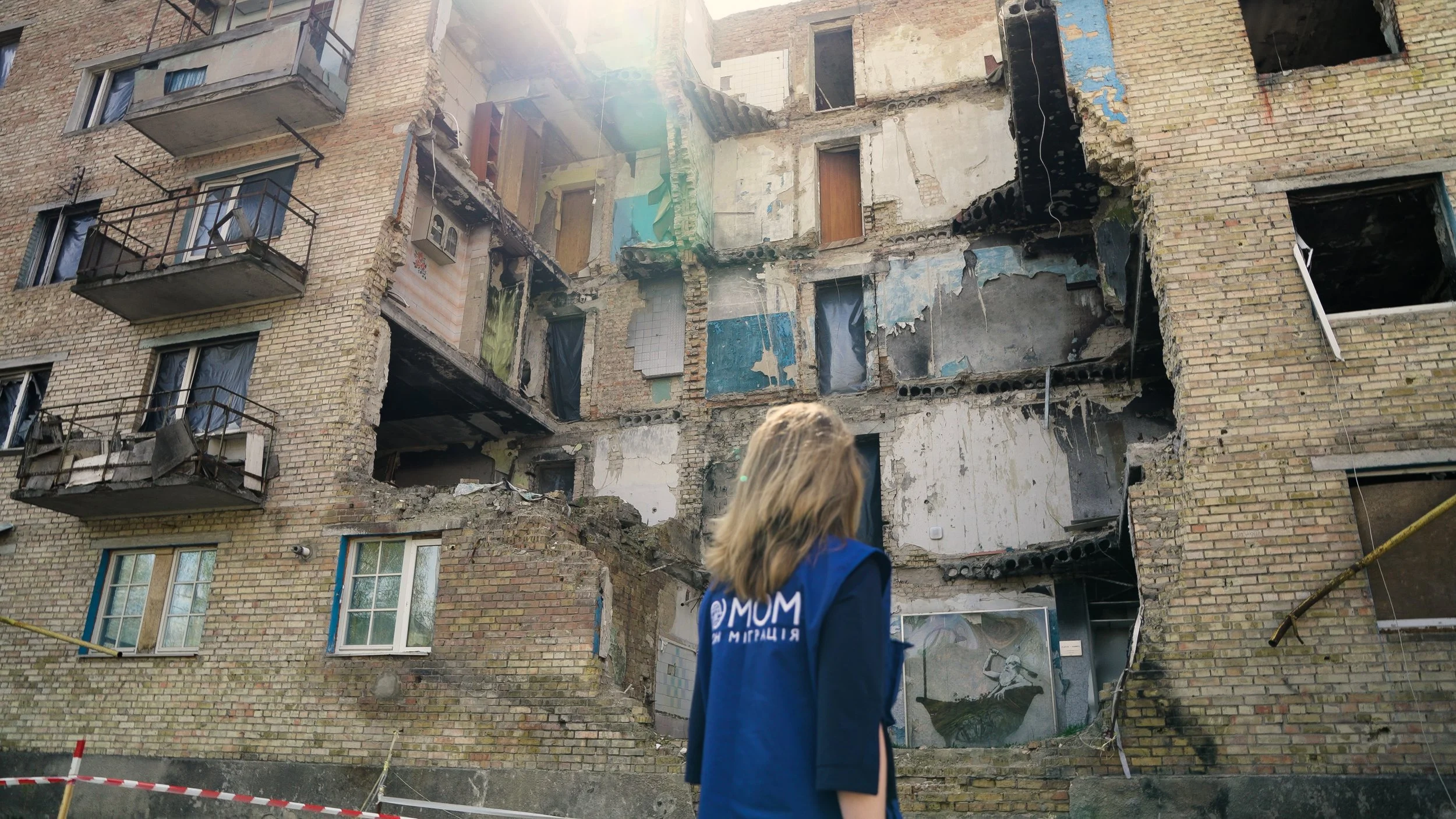 In Bucha, a city made infamous by wartime atrocities, IOM supports recovery efforts—repairing housing, restoring utilities, and helping families return.