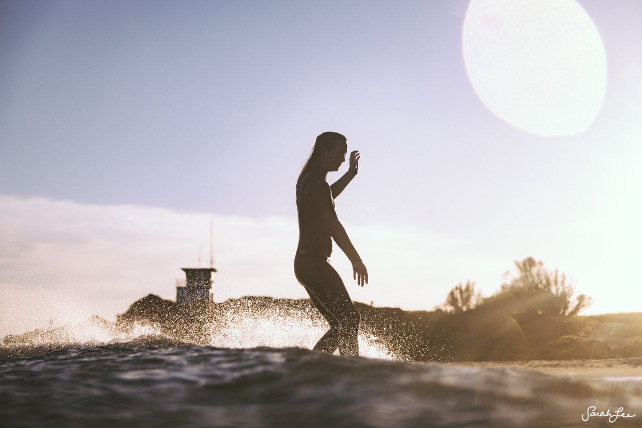 Anna Ehrgott surfing Malibu County
