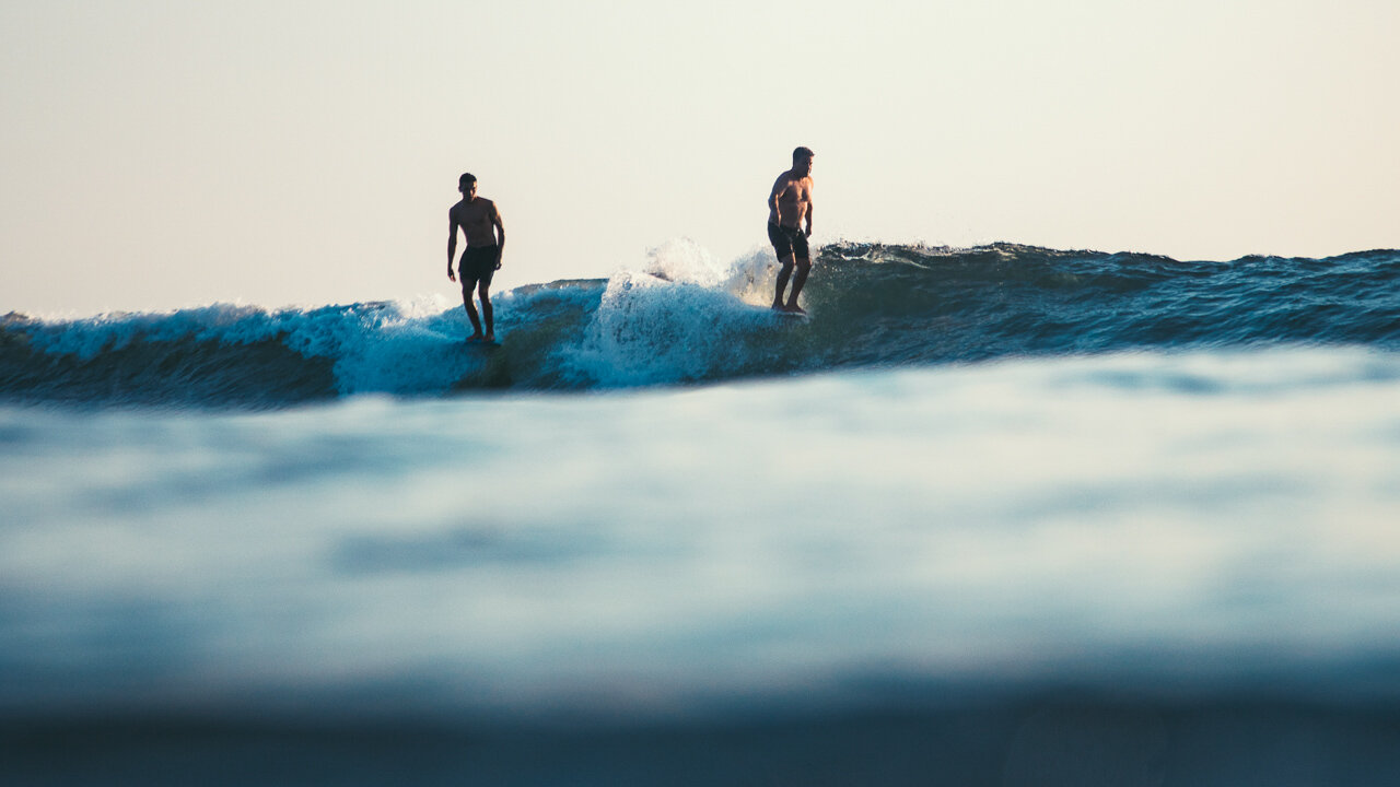  Father + Son Party Wave: Kaimana and Michael Takayama nose riding. 