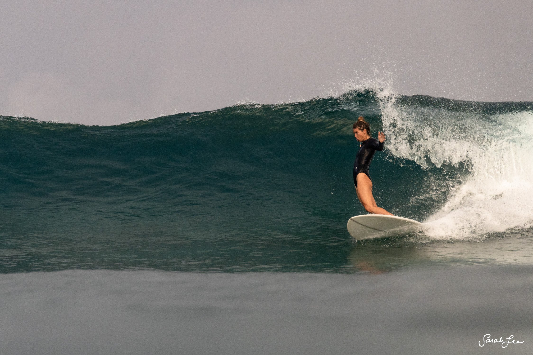 Leah Dawson stylish bottom turn on a mid length twin pin egg by Alex Lopez