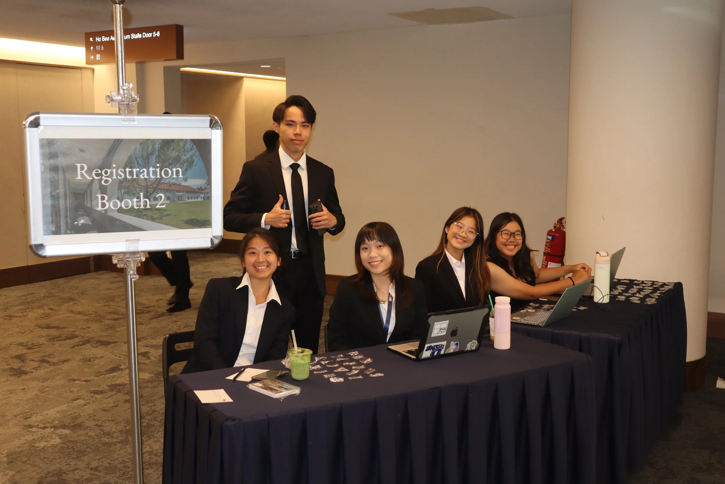 Year 2s manning the registration booth for the Ceremony