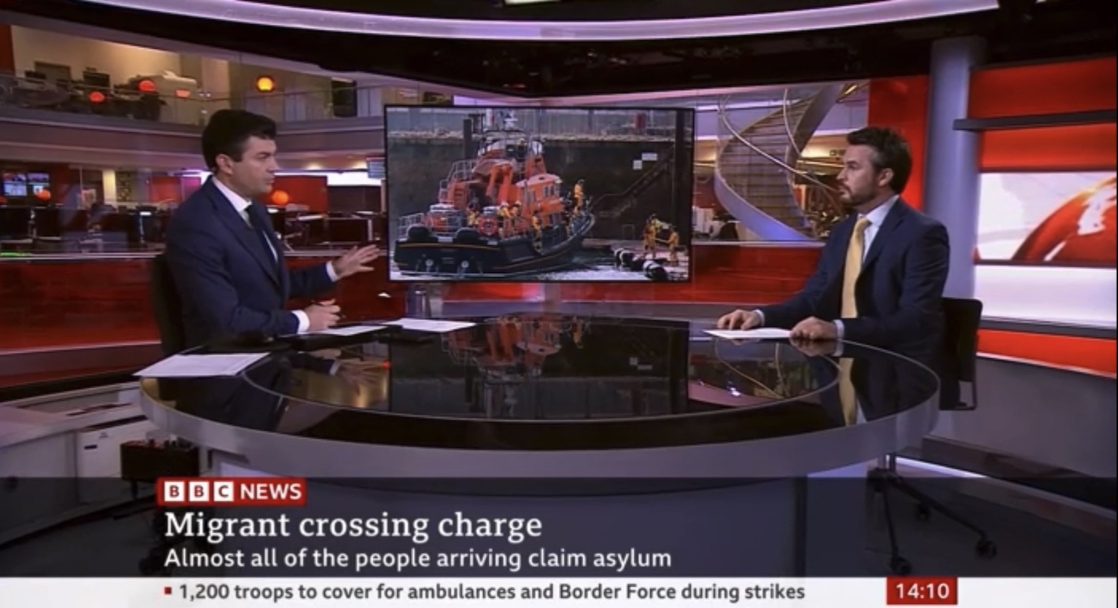 Covering breaking news on the BBC News Channel.
