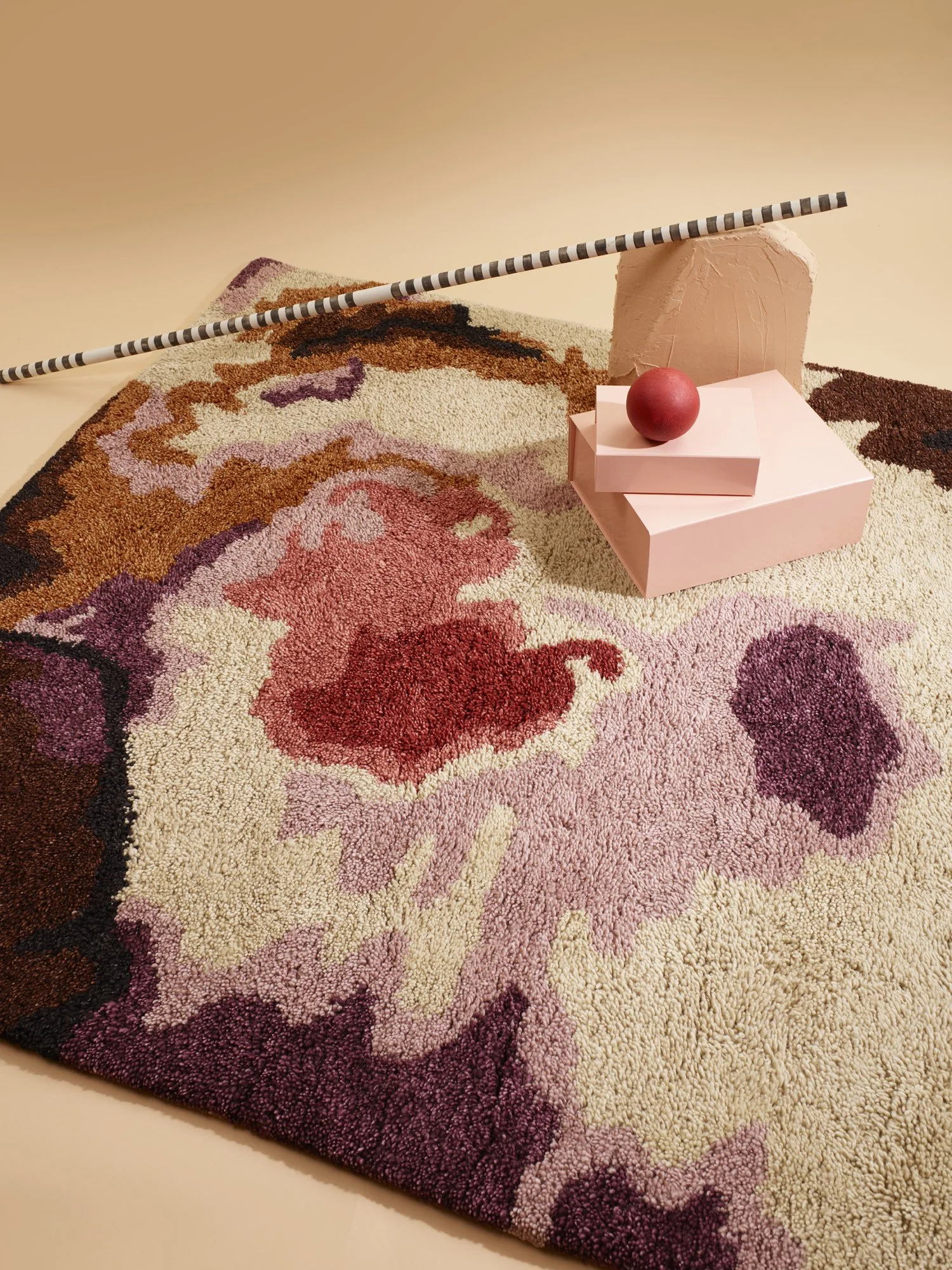 Colourful carpet in tones of red, purple and brown