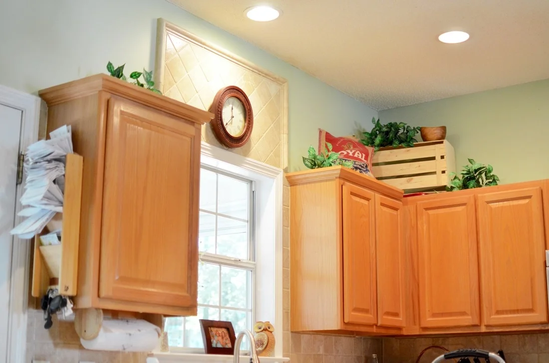 As you can see, our cabinets were not terrible but they were very orange and they did have a lot of space above them! My thought process was that building boxes would help bridge the gap above the cabinets and serve as extra storage.