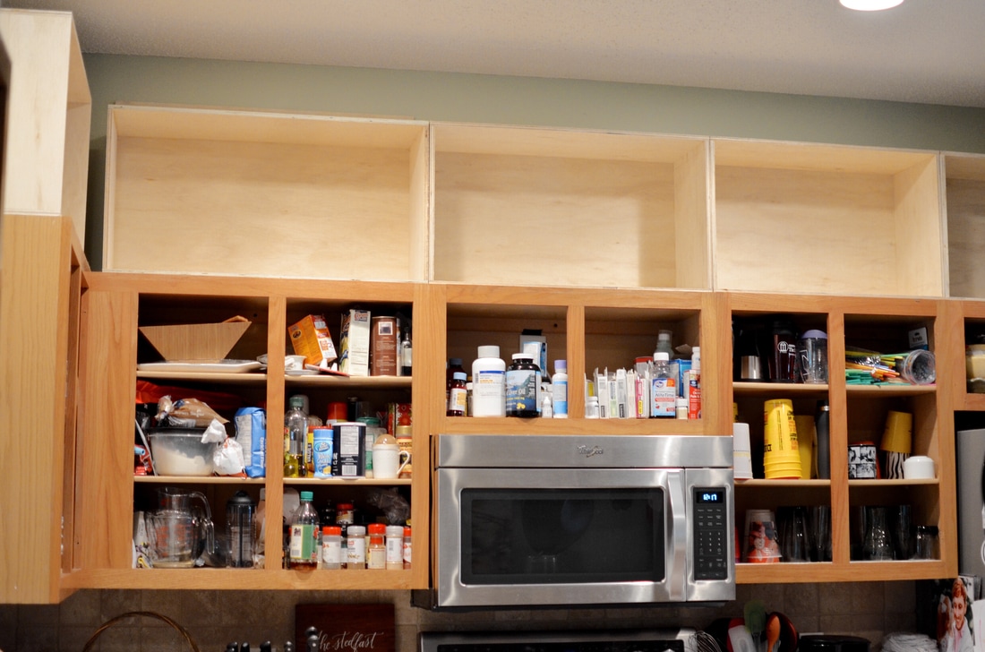 After building the boxes for the top (See previous post), I then moved on to removing all of the cabinet doors. (Yikes! - who knew we had all of that in our cabinets?)