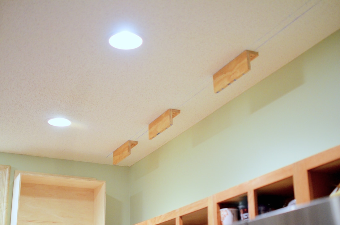 And we are finished attaching brackets to the ceiling! We are now ready for the boxes and face frame!
