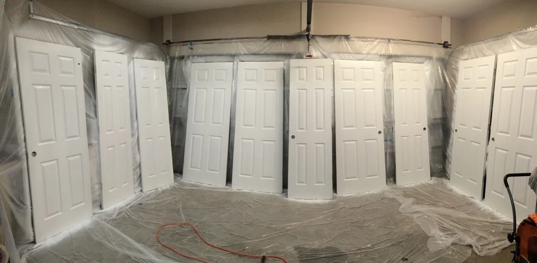 Getting the doors off of the hinges and into the garage and hanging plastic did take some time, however painting these doors with the sprayer took no time at all. So worth it!