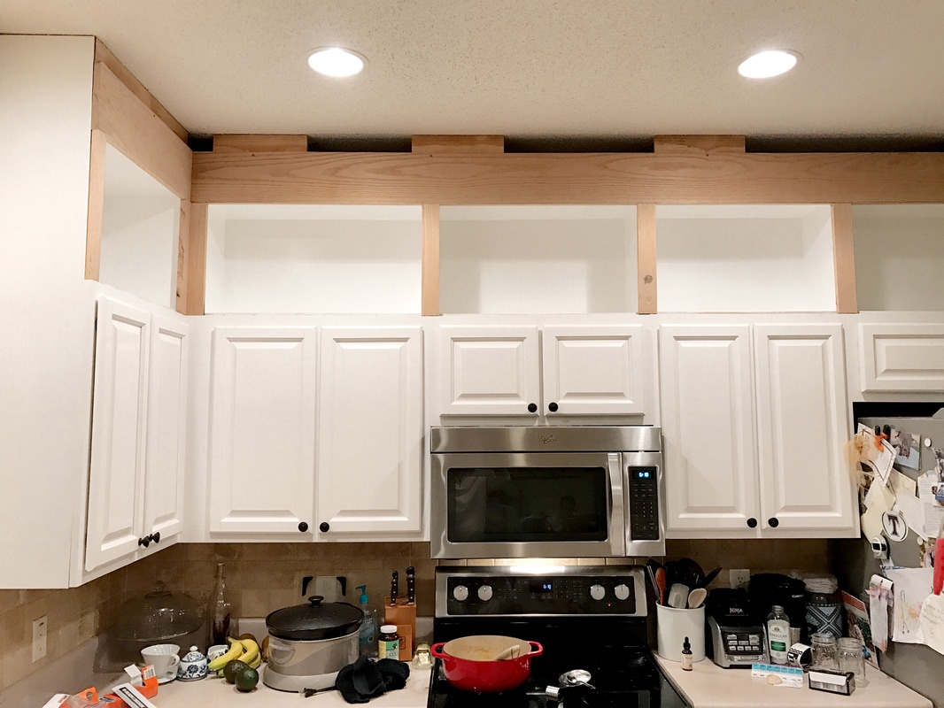As you can tell, I was not worried about the wide oak board going all the way to the ceiling. That would be covered by the moulding later. I used screws to attach to ceiling and brad nails to attach to lower cabs