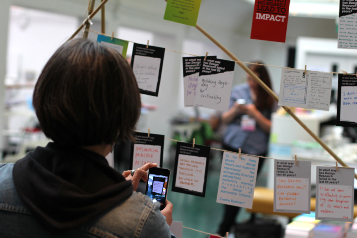 A DRS2016 conference participant documenting one of the responses submitted at the DRF exhibit. The analog exhibit itself was constantly morphing as participants wrote out new responses. Alongside this, a dedicated Twitter channel were sharing the responses. After the conference, all responses were shared on the web platform .